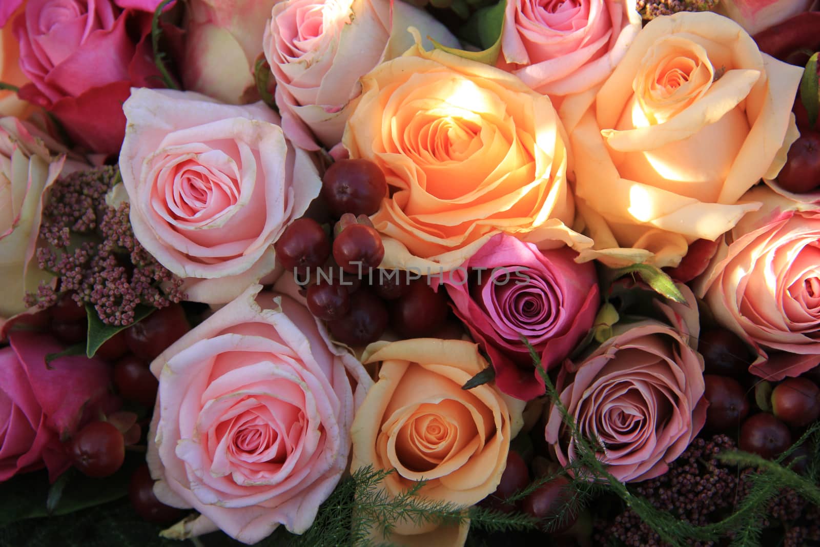 Pastel roses in different shades of pink in a bridal arrangement