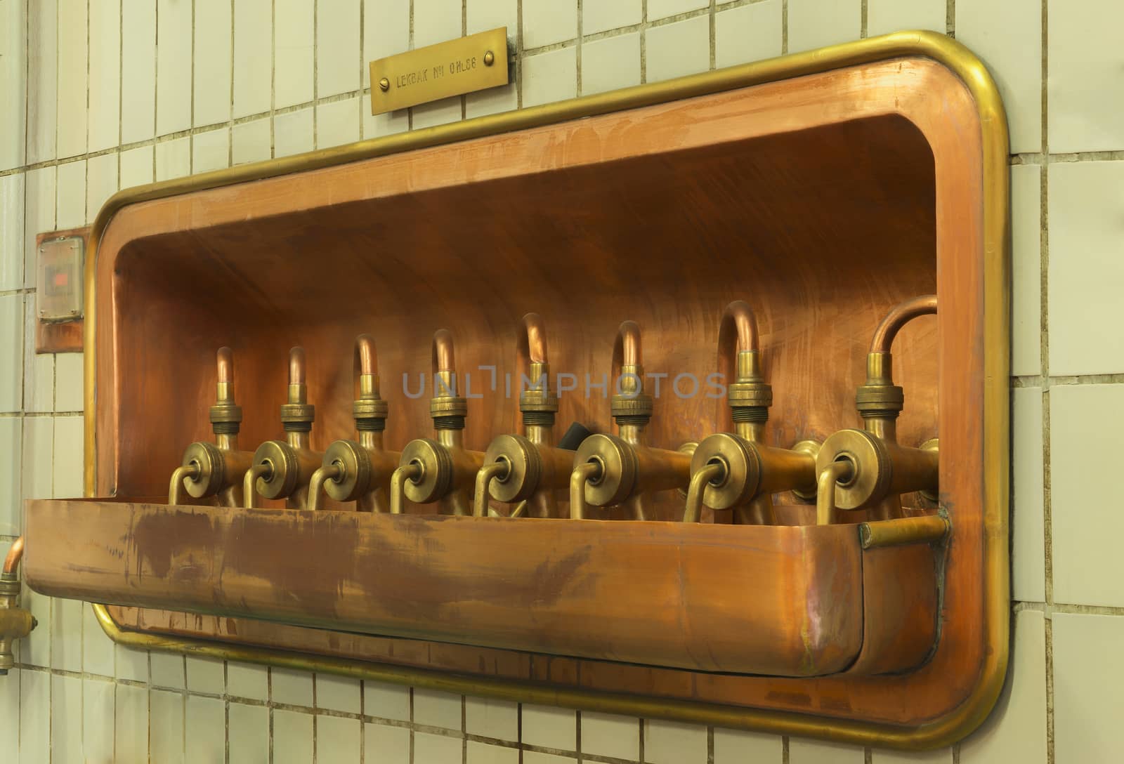 Line of siphoning faucet to drain the wort, pre-beer, from the mash tun, as seen at Brewery De Brabandere in Bavikhove, Belgium.