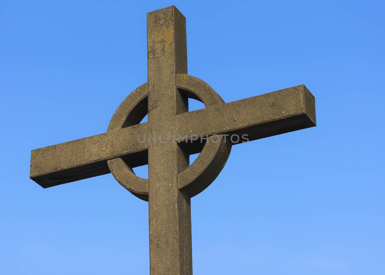 Top of Irish cross against blue sky used as memorial for fishermen lost at sea in Zeebrugge-Seabruges, Belgium.