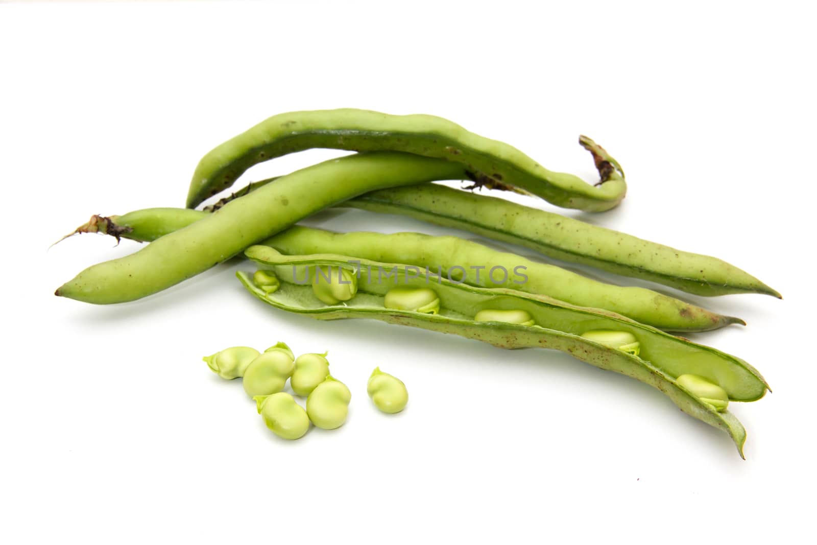 Fresh broad beans on a white background