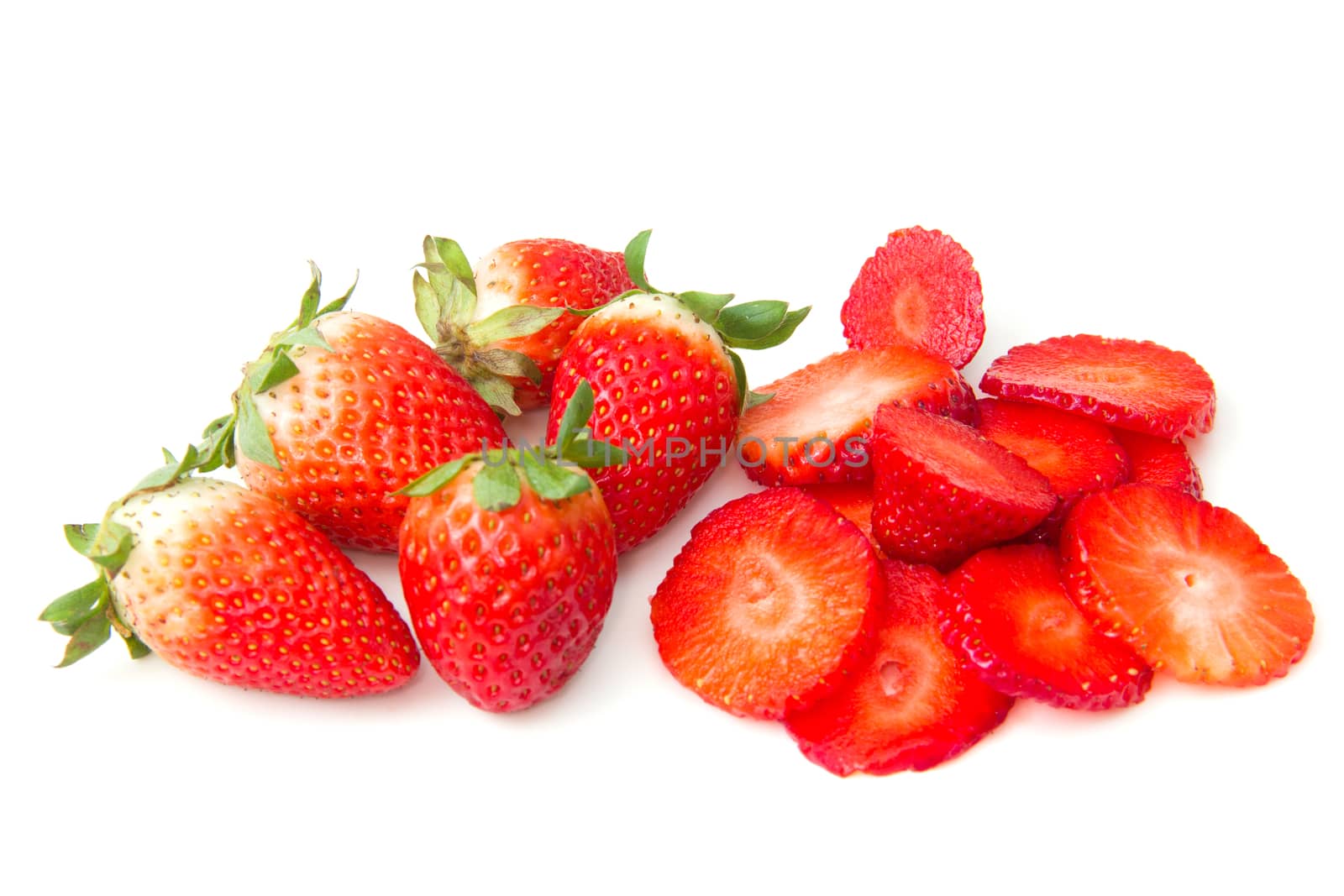 Sliced strawberries on a white background