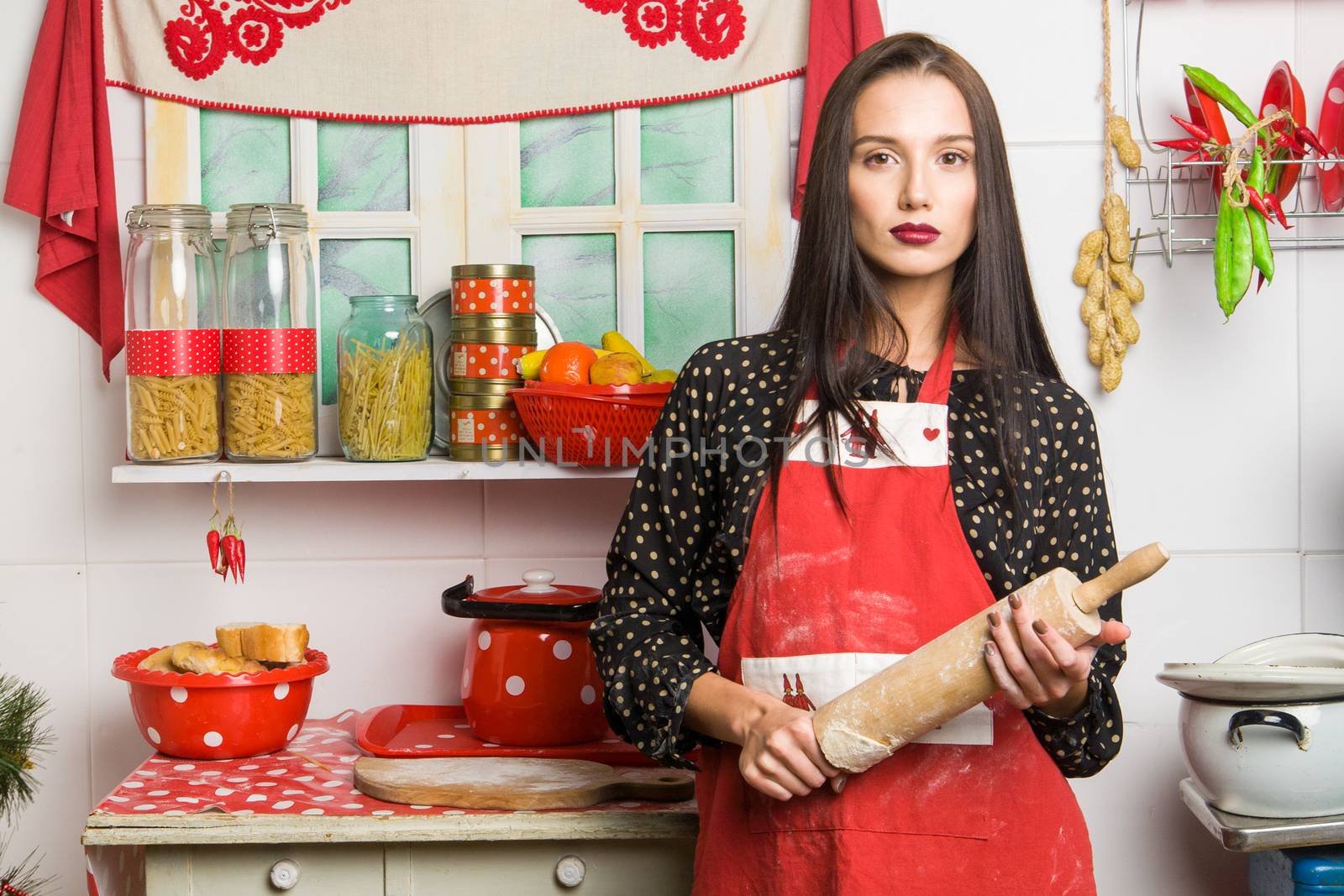 Housewife in the kitchen. Positive concept, closeup.