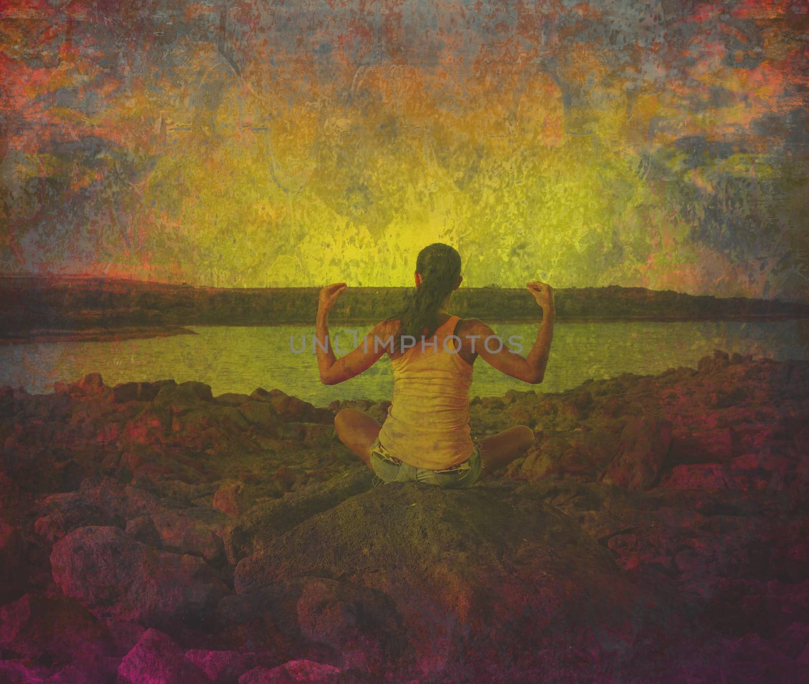 girl in lotus position on the rock - grunge background