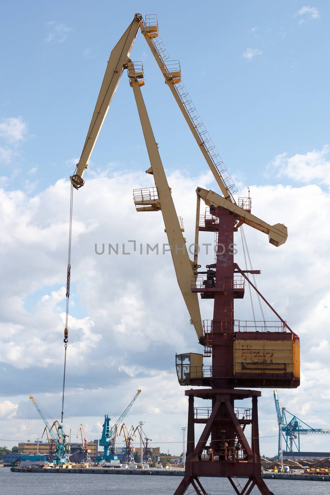 Port crane against blue sky
