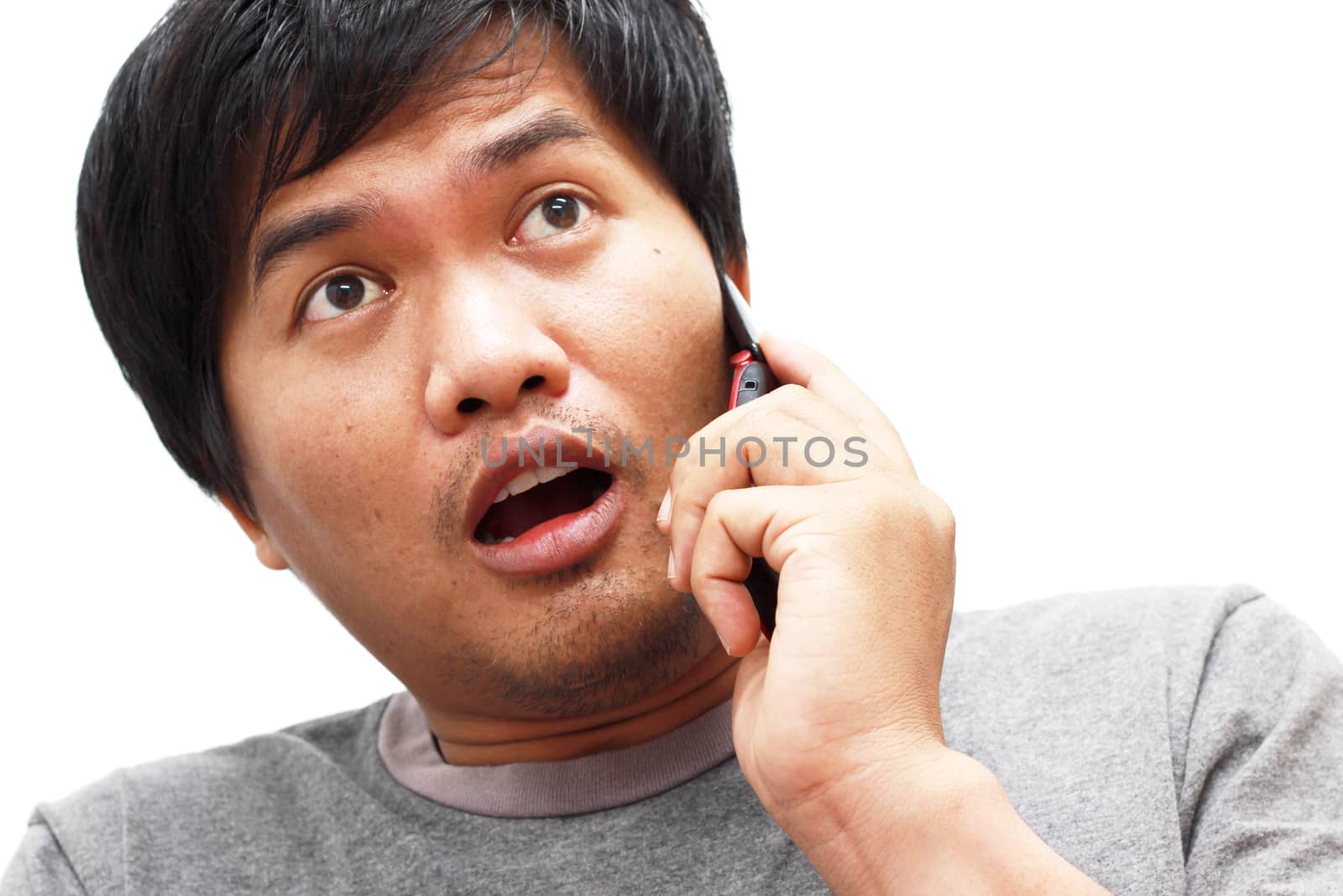 man talks at mobile phone