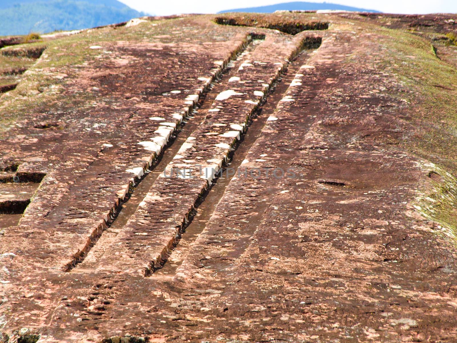 Two channels on the rock in archeological site El fuerte of Samaipata (Bolivia)