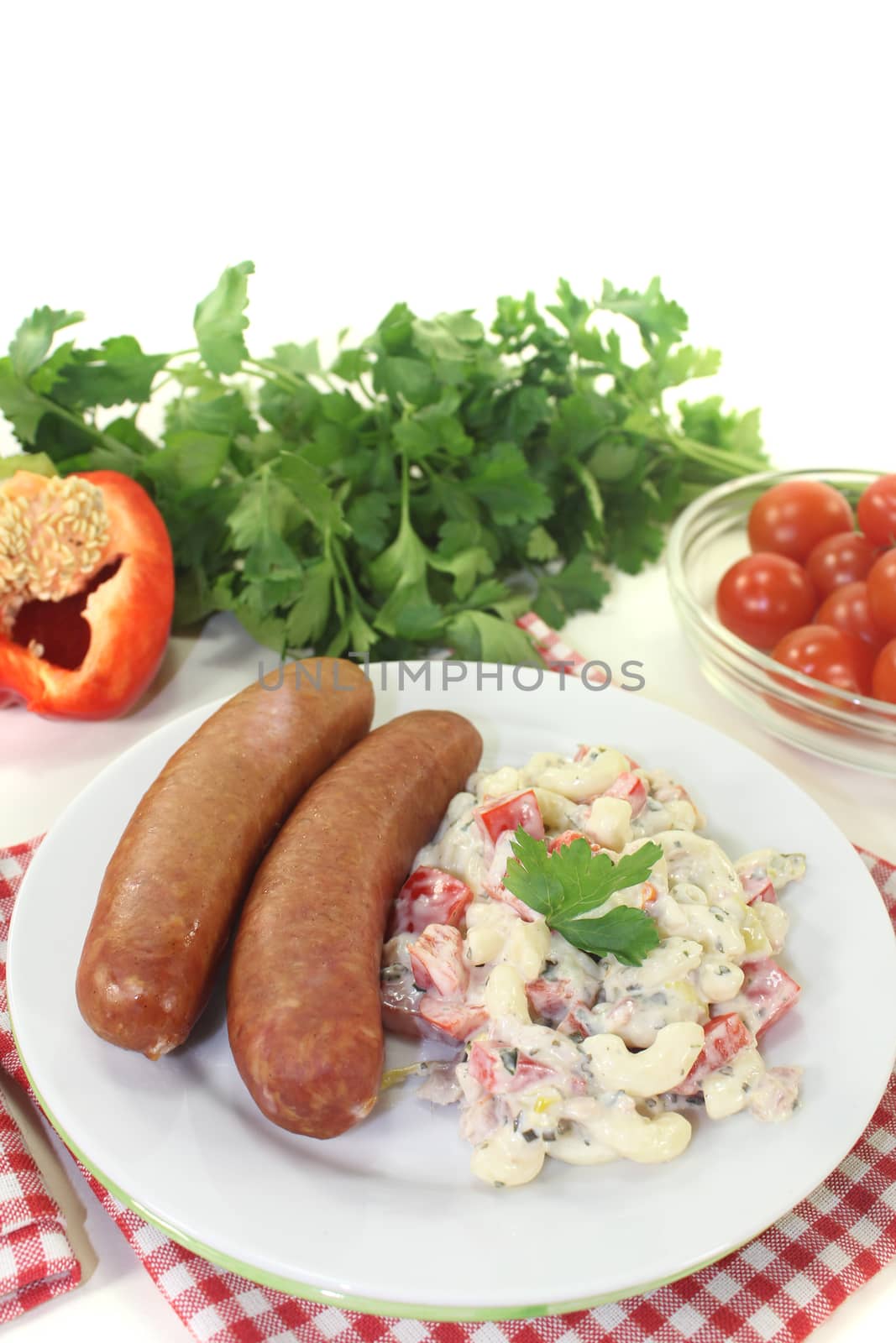 pasta salad with bell pepper and Mettenden on a light background
