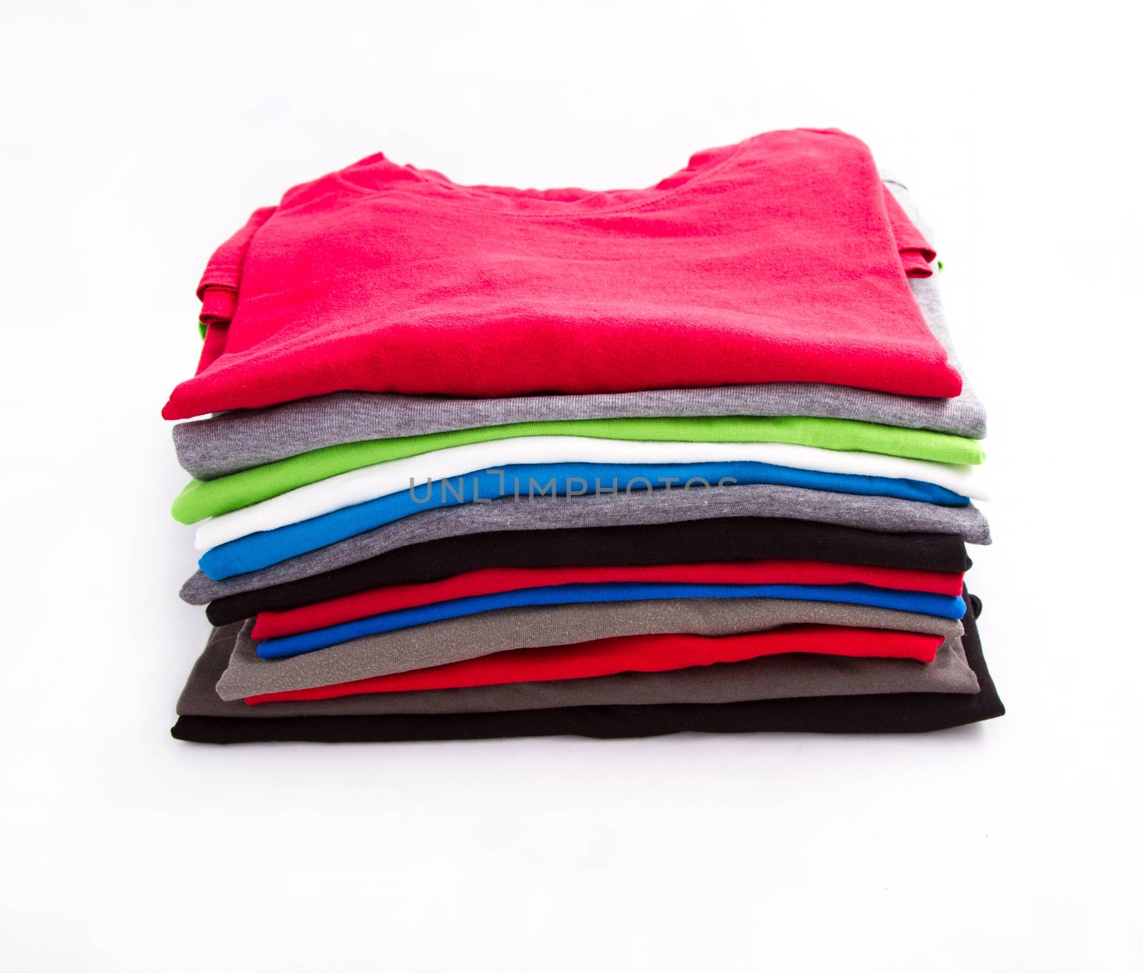 A pile of folded T shirts 
