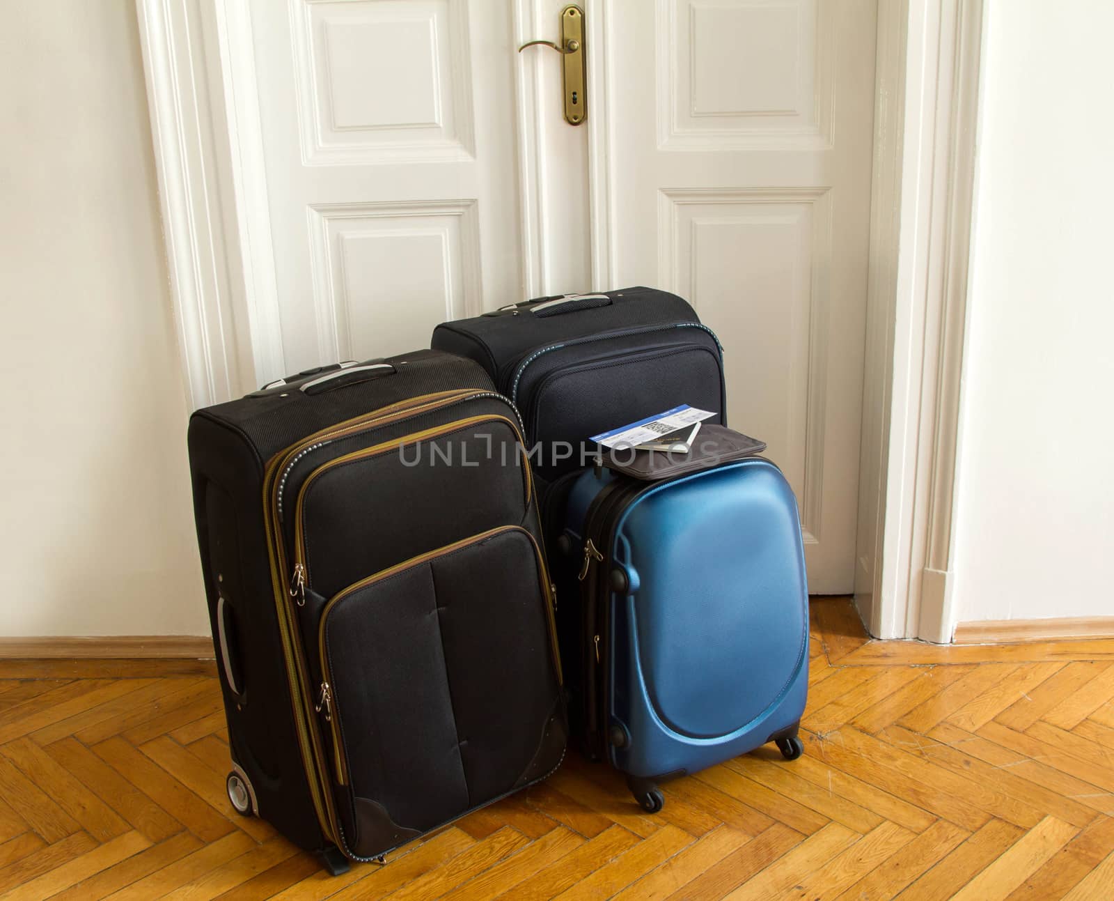 Airline ticket, passport and luggage, ready to travel
