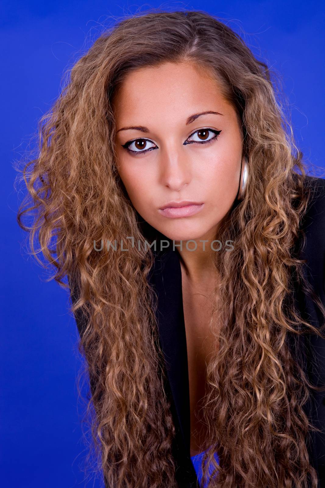 young beautiful woman, on a blue background