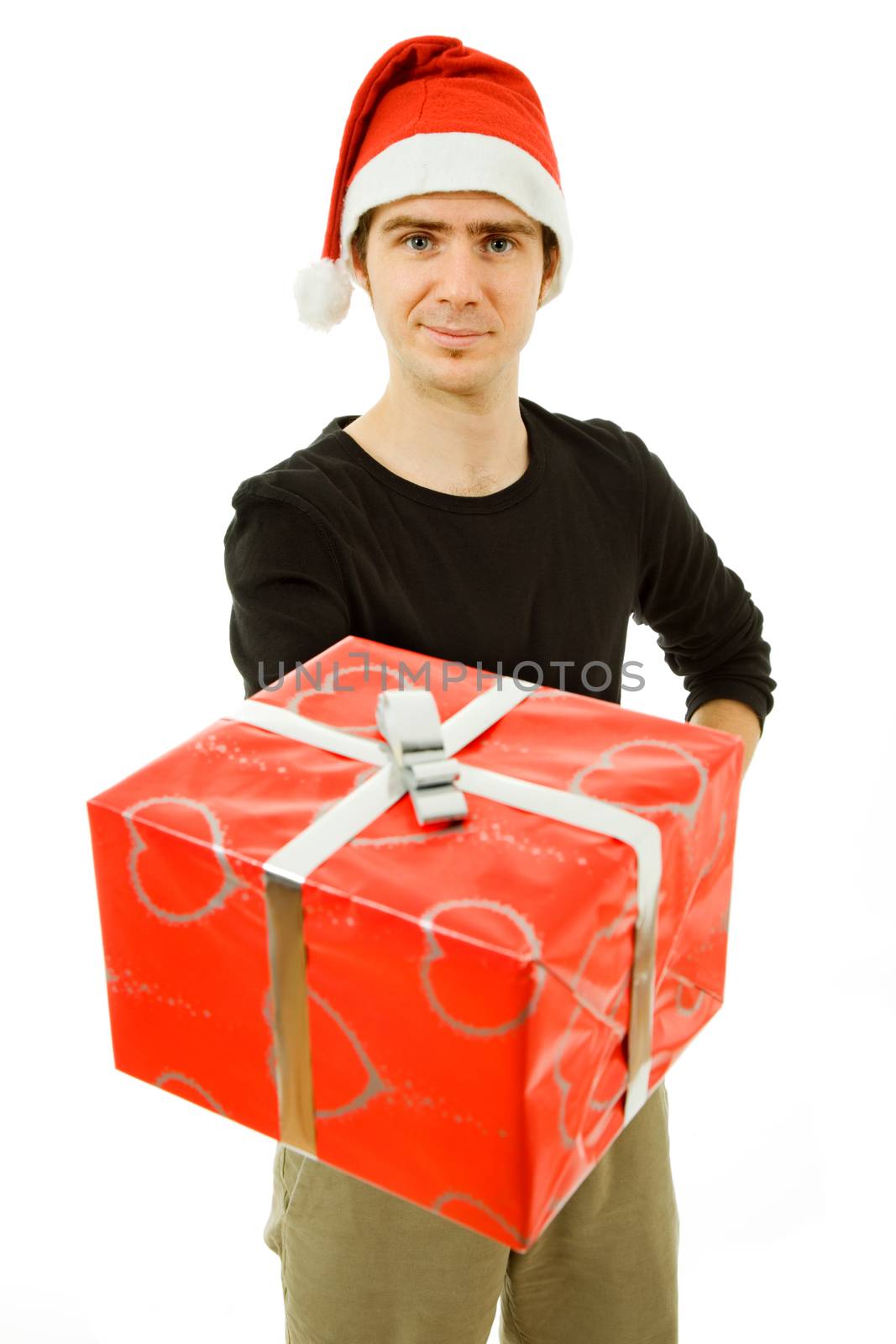 young man with santa hat holding a gift, isolated