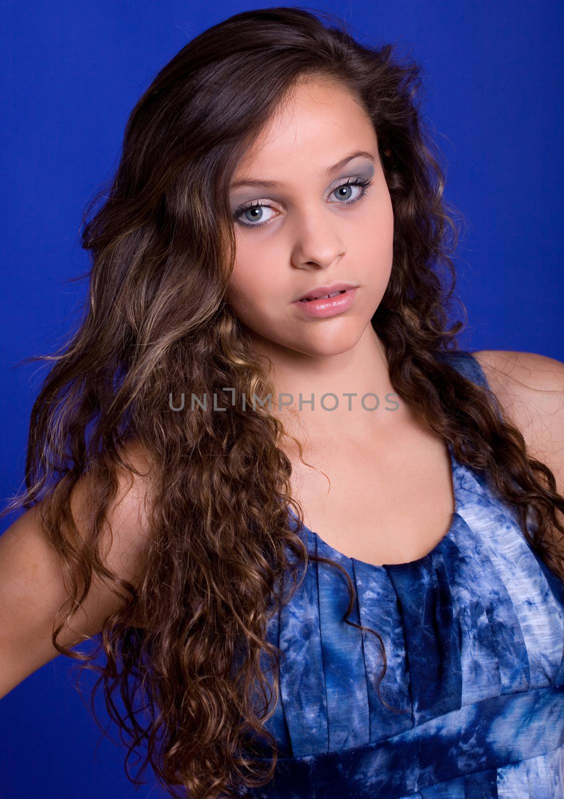 young beautiful woman, on a blue background