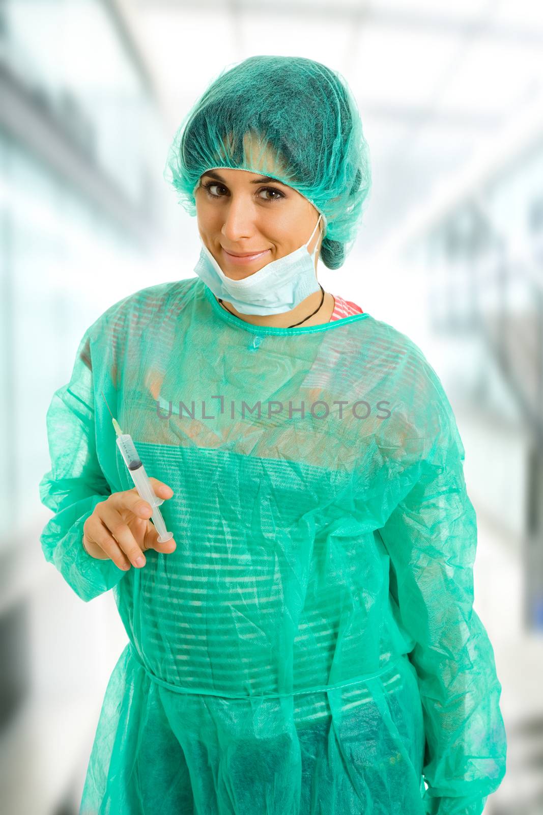 young woman nurse portrait with a syringe