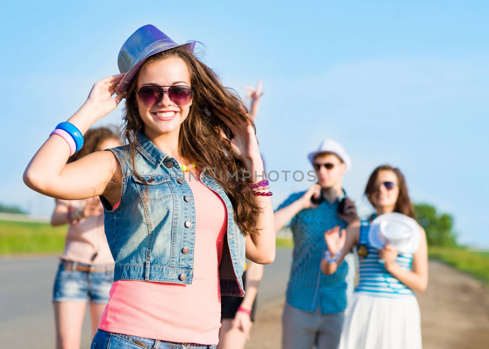 stylish young woman in sunglasses by adam121