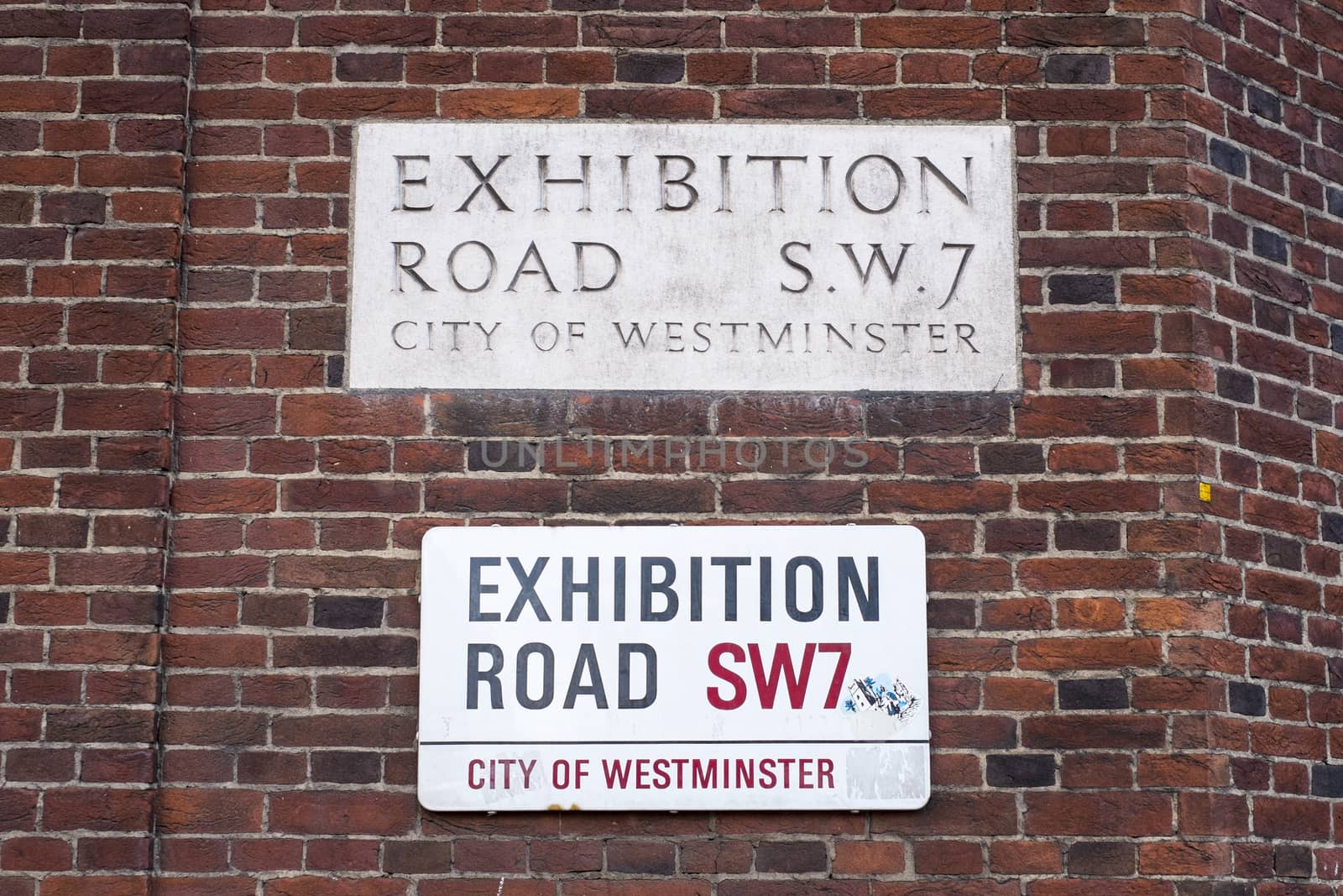 An old and a new version of road signs for Exhibition Road in London, UK