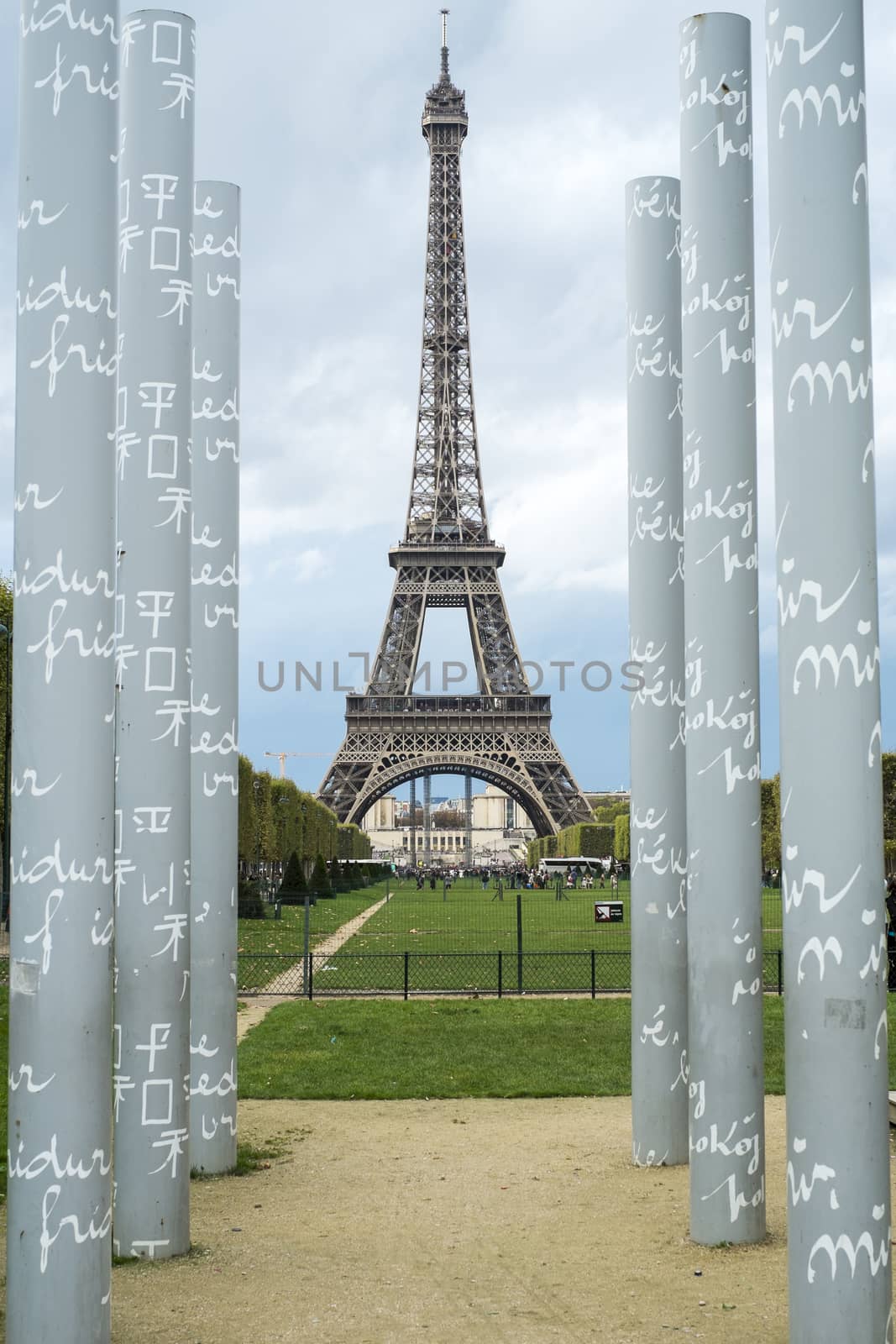PARIS, FRANCE - OCTOBER 20: The Eiffel tower framed by obelisks of the mur de la paid, in Champ de Mars. October 20, 2013 in Paris.