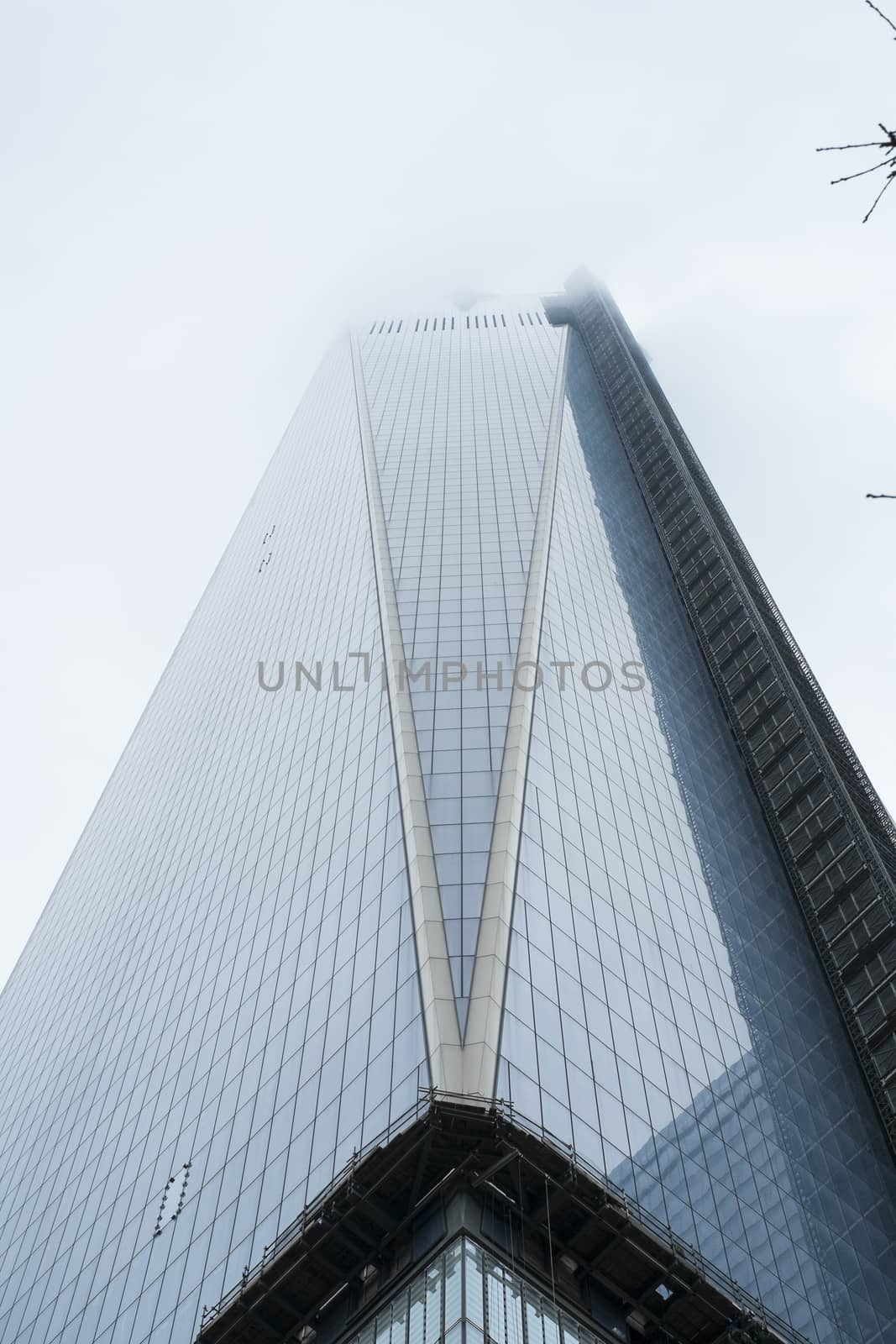 NEW YORK, US - NOVEMBER 22: Low angle shot of new World Trade Centre building engulfed by low hanging clouds. November 22, 2013 in New York.