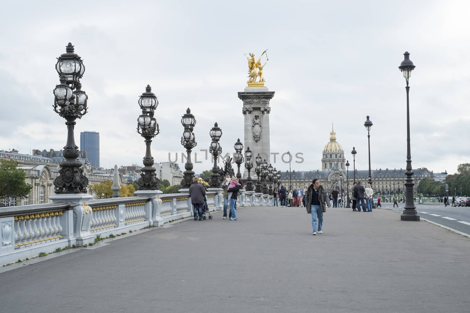 PARIS, FRANCE - OCTOBER 20: Pont des Invalides with Hopital des Invalides in the far background. October 20, 2013 in Paris.