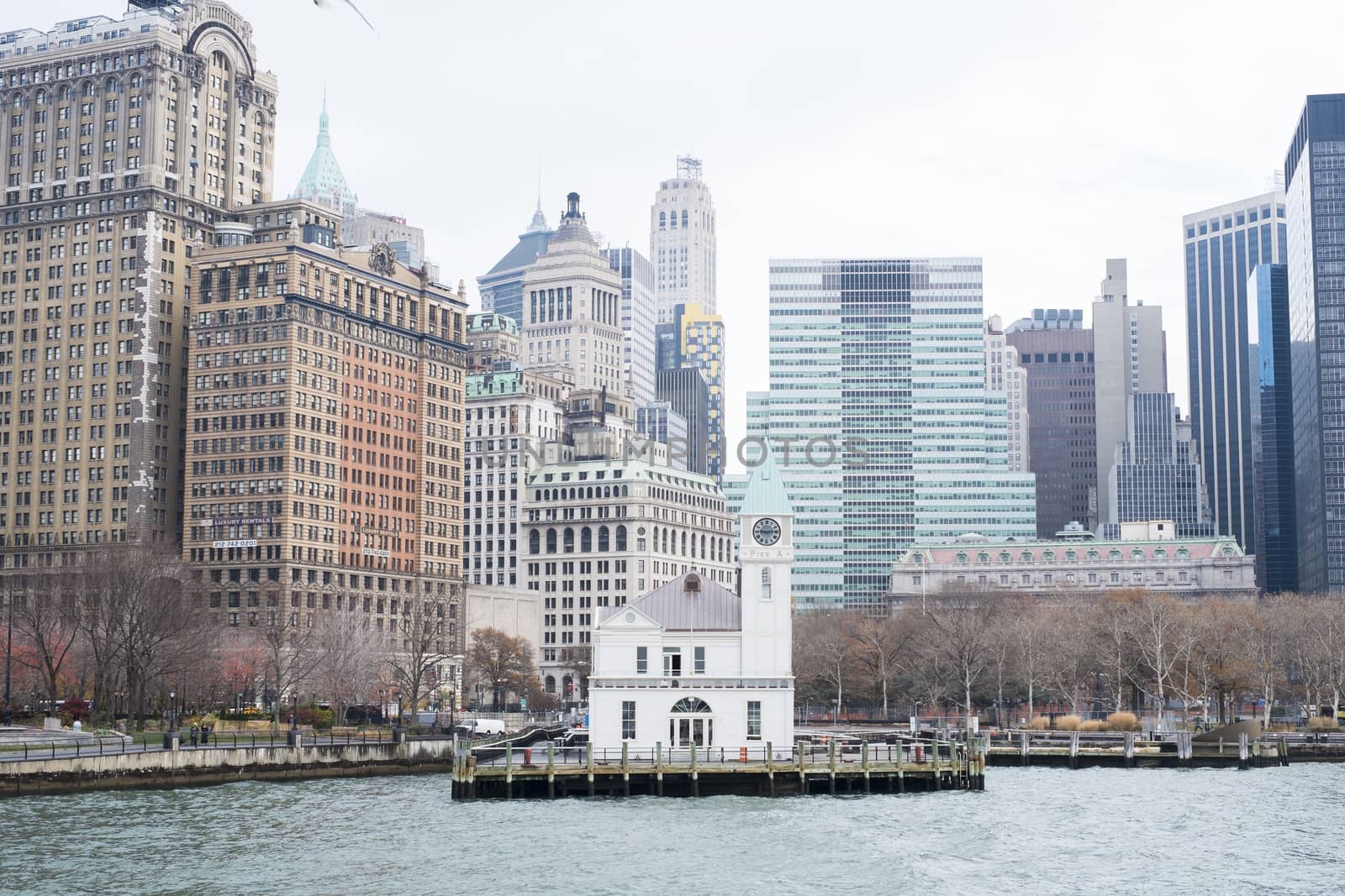 NEW YORK, US - NOVEMBER 22: Small rustic pier with Manhattan skyline in the background. November 22, 2013 in New York.