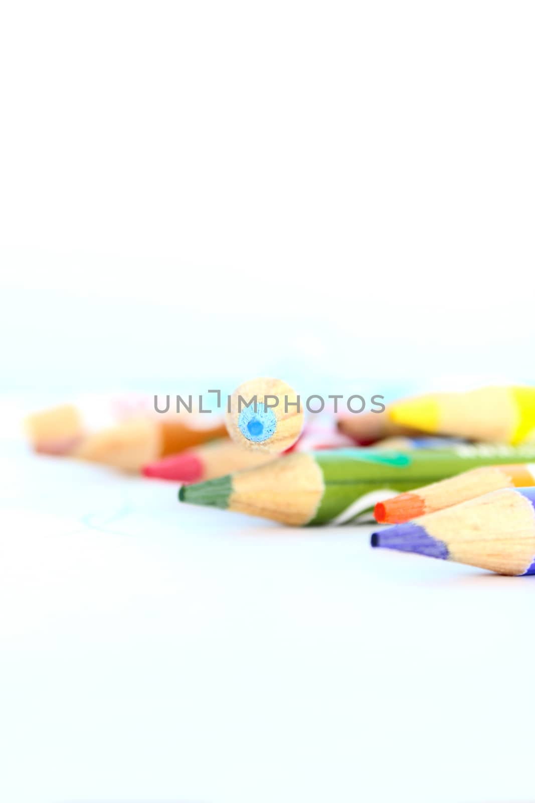 Bunch of colouring pencils on a white table
