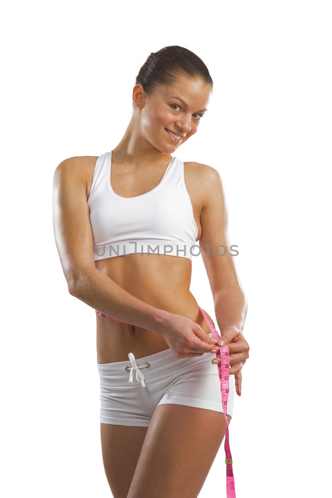 athletic woman measuring waist by adam121