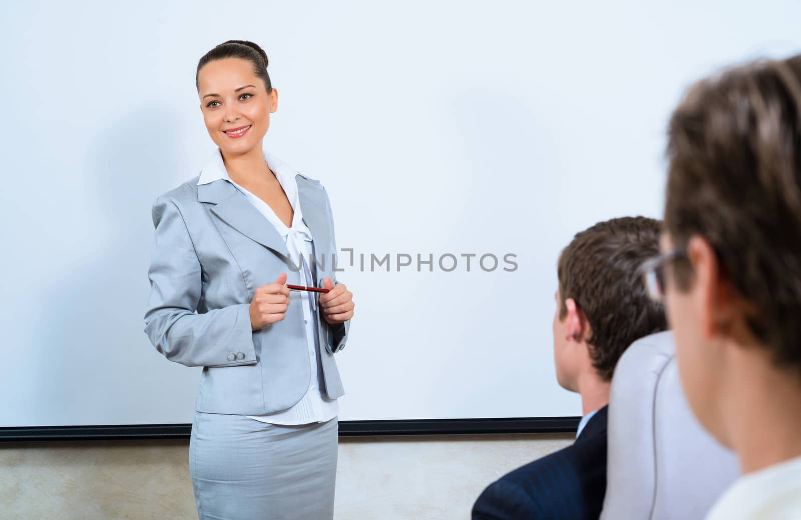 image of a discusses business woman with colleagues