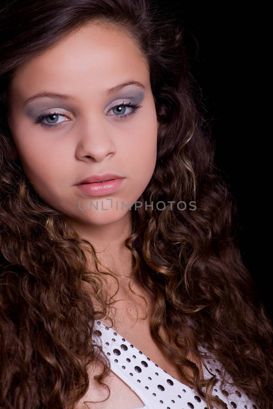 young beautiful woman, on a black background