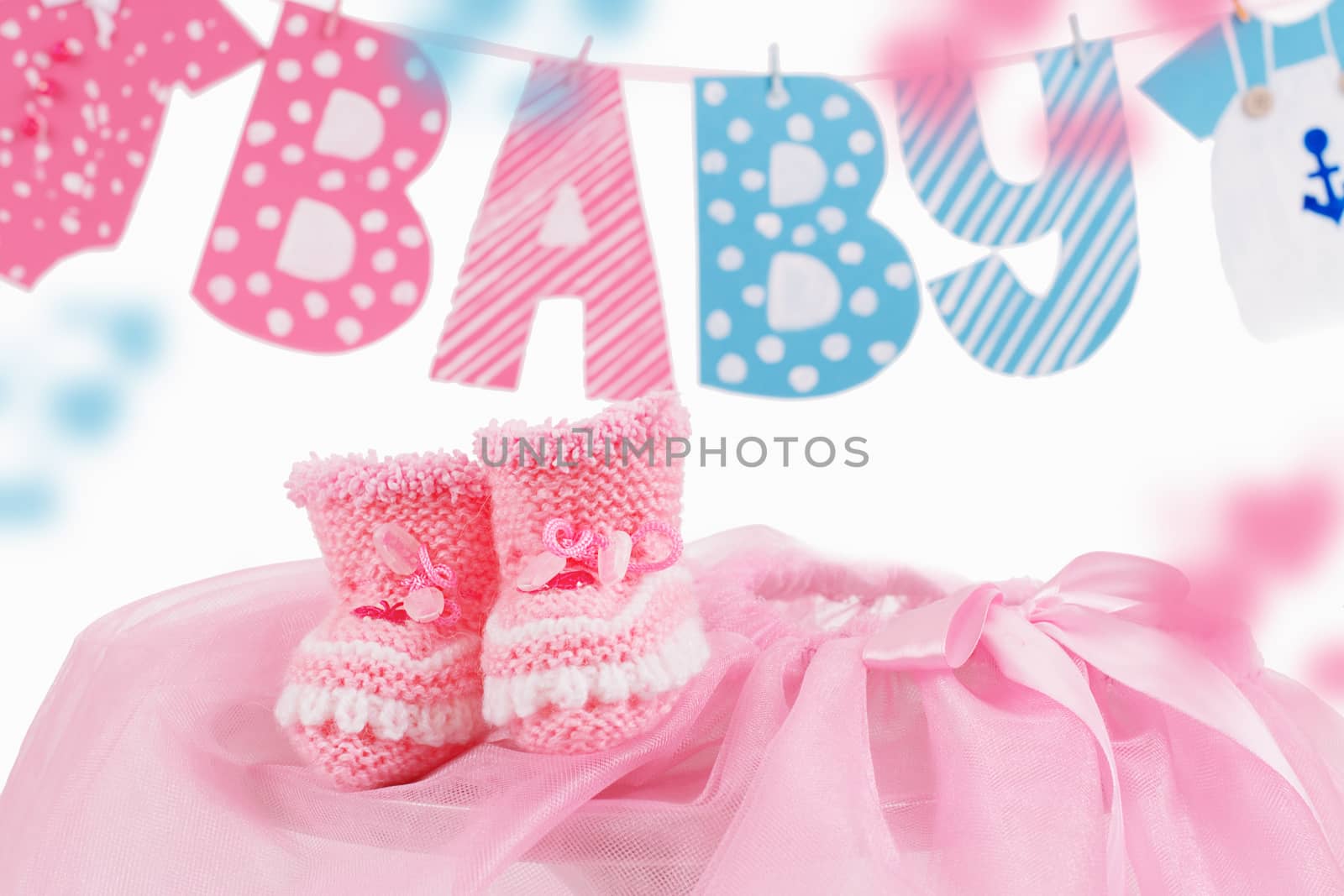 Cute baby element with word baby and pink bootees over white