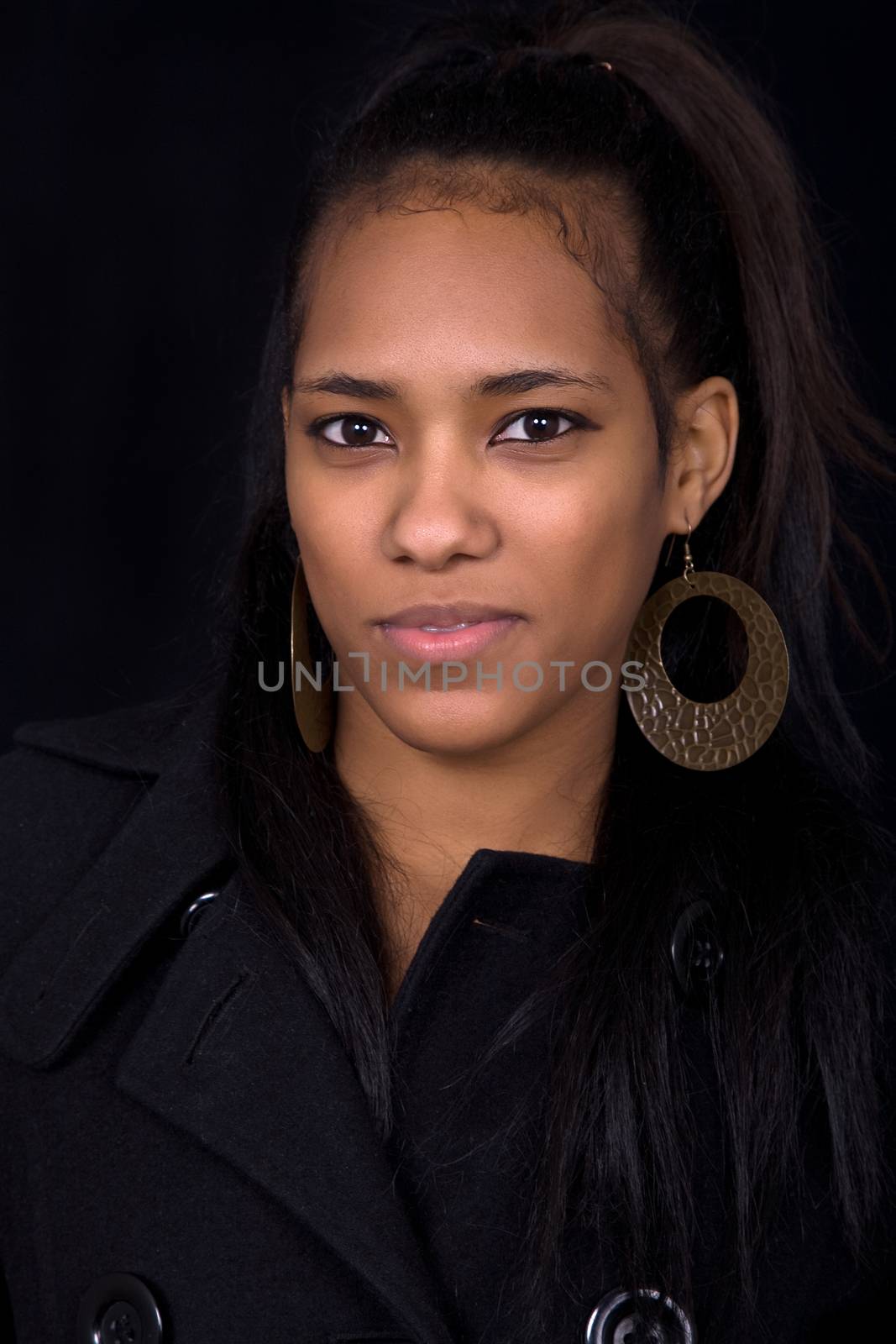 young beautiful woman close up portrait, on black background