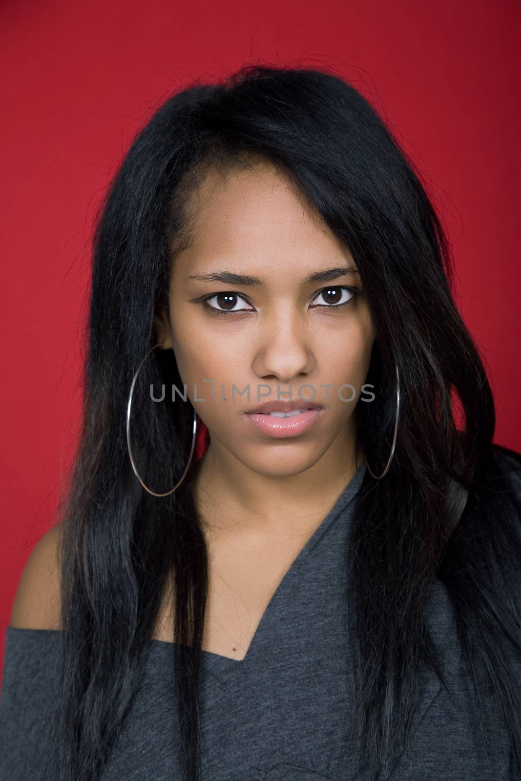 young casual woman close up portrait, studio shot