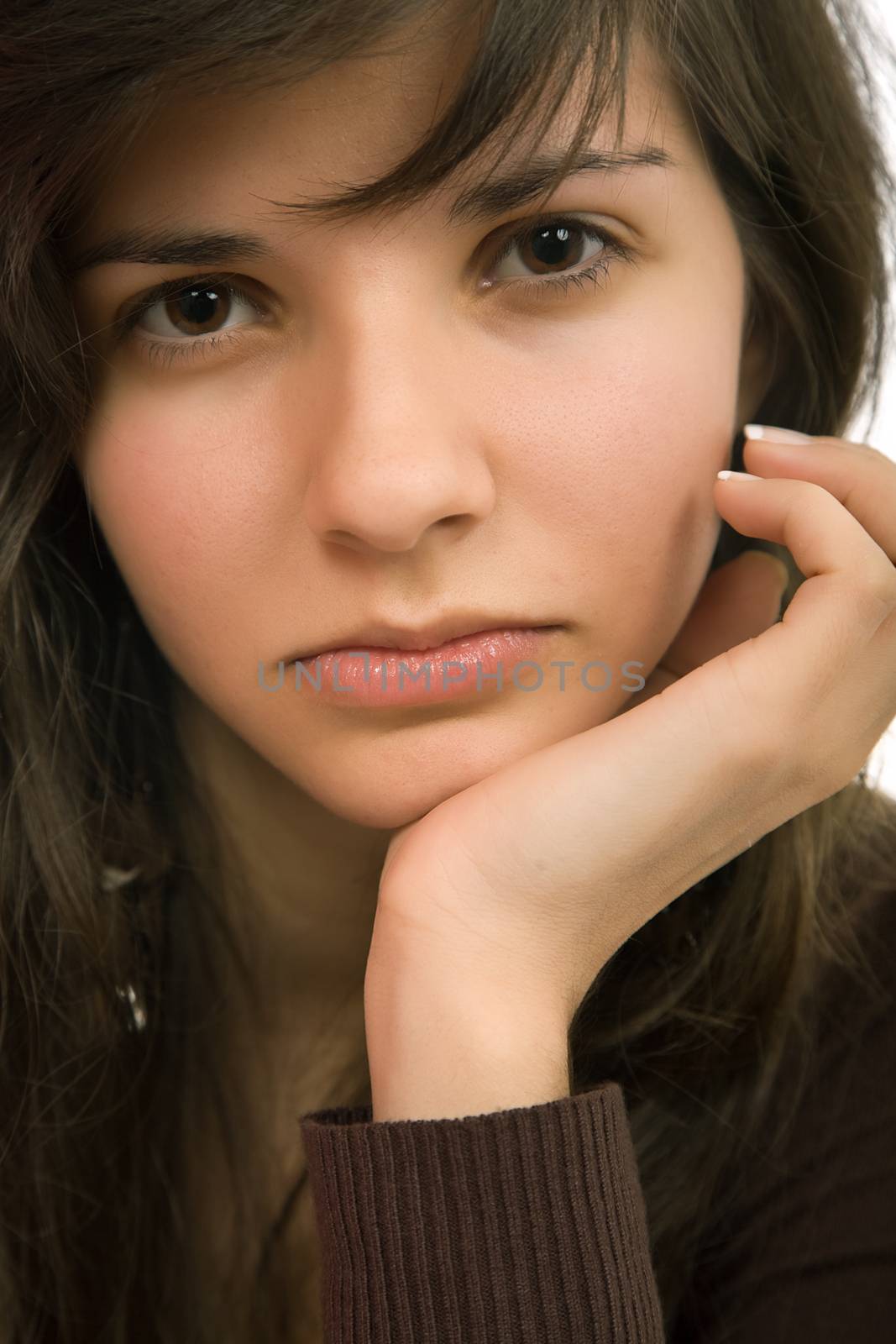 young beautiful pensive woman close up portrait