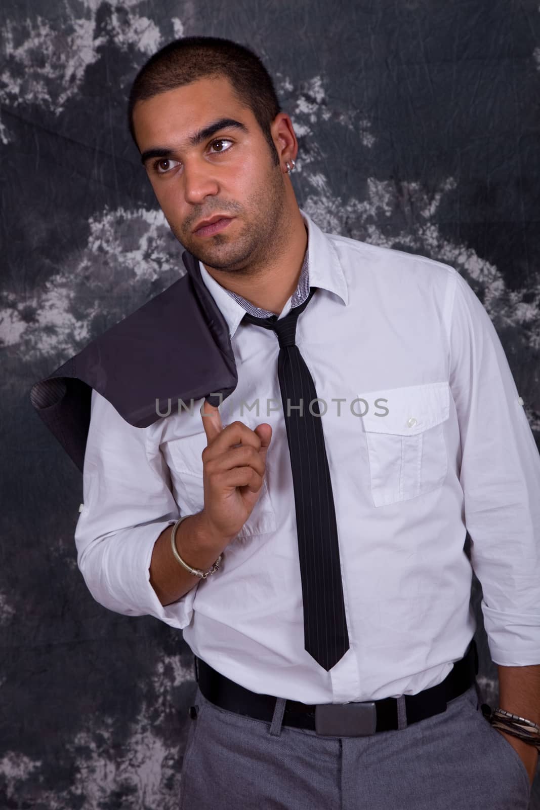 young business man, in front of a dark background