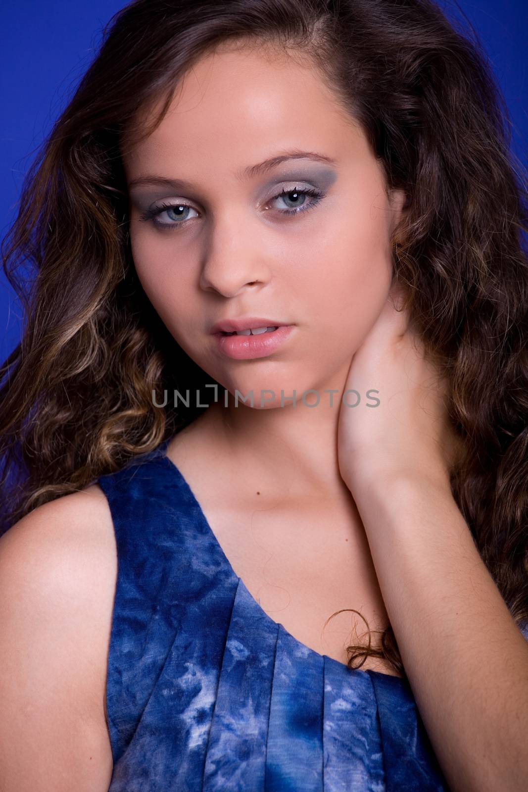 young beautiful woman, on a blue background