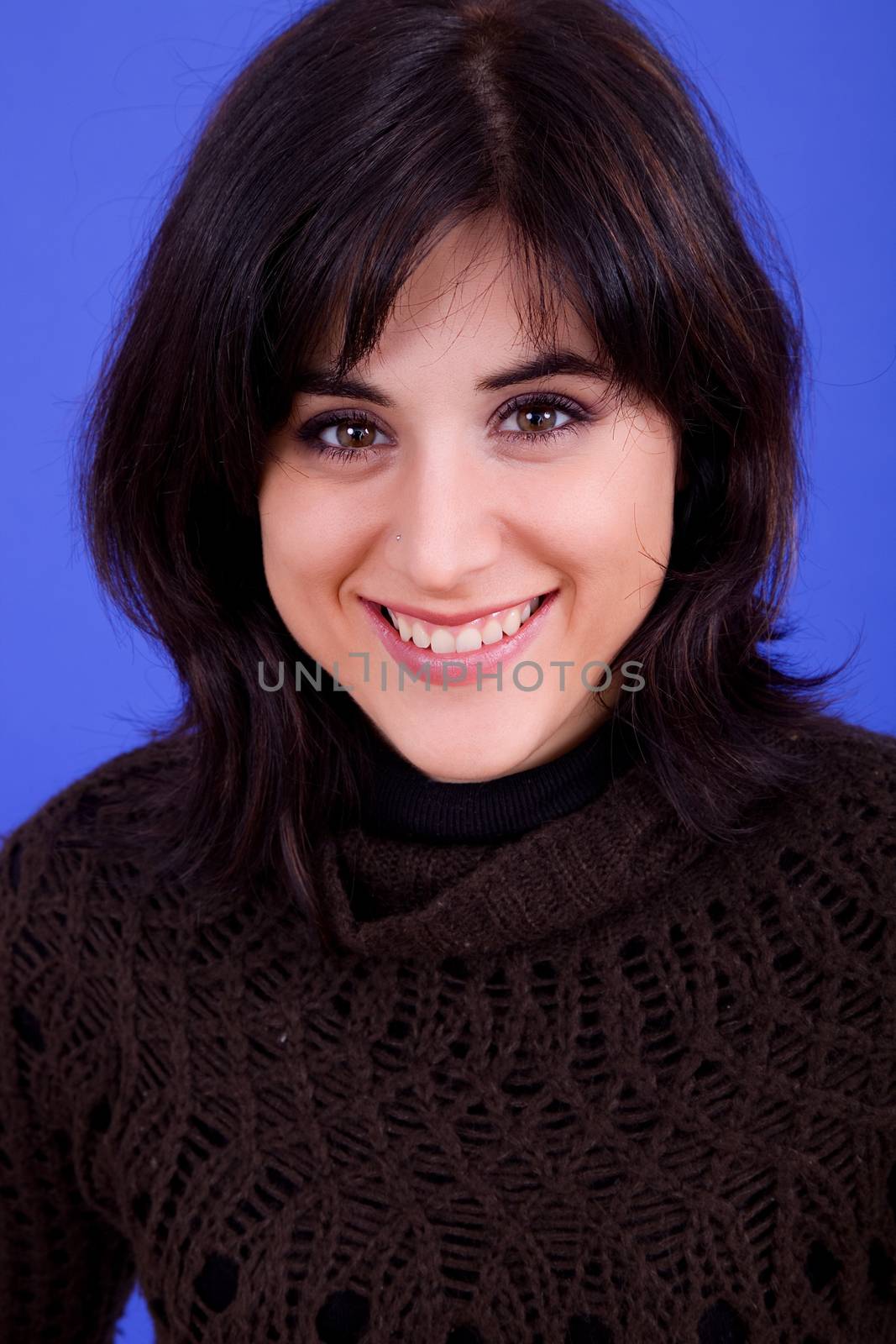 young beautiful woman, on a blue background