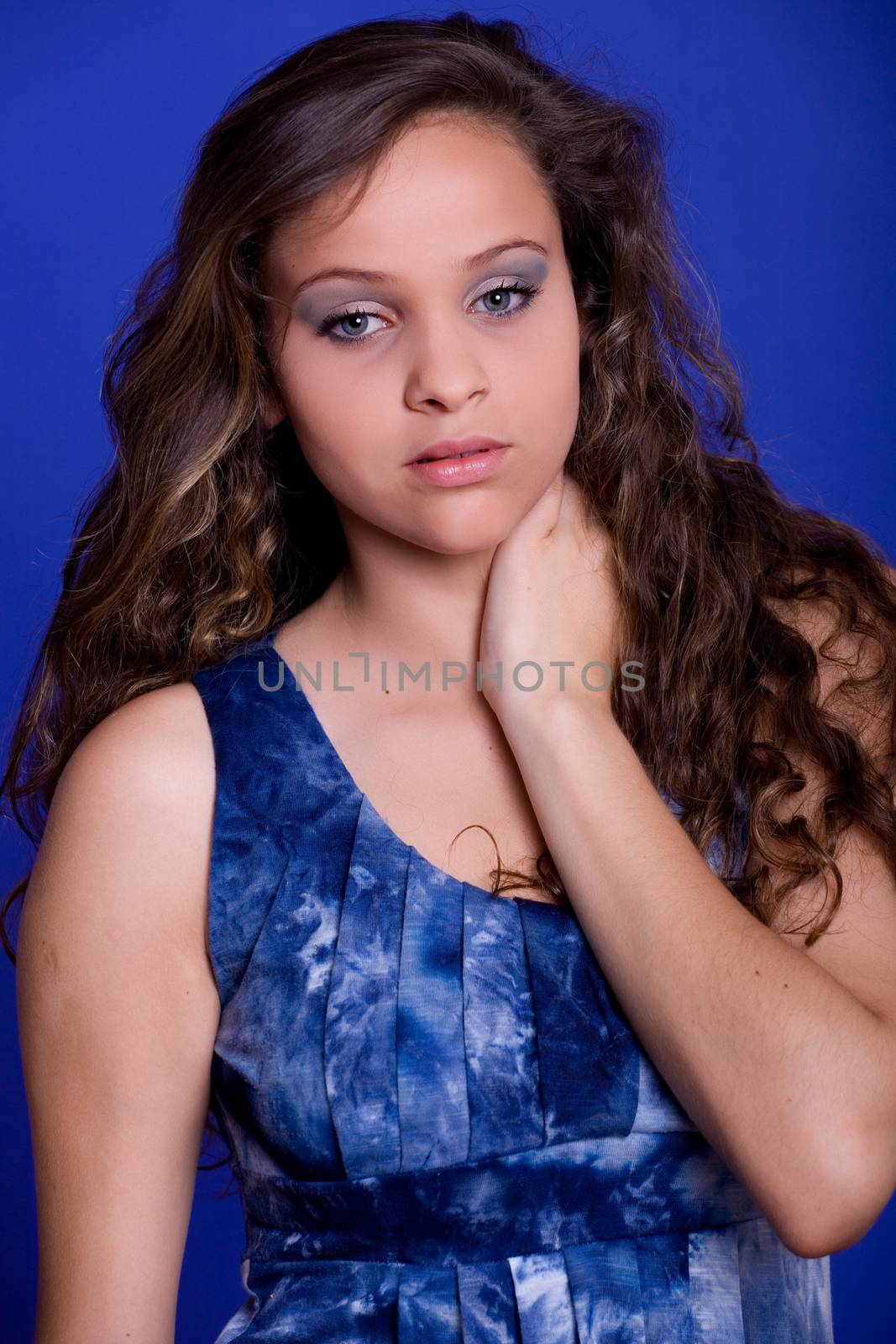 young beautiful woman, on a blue background