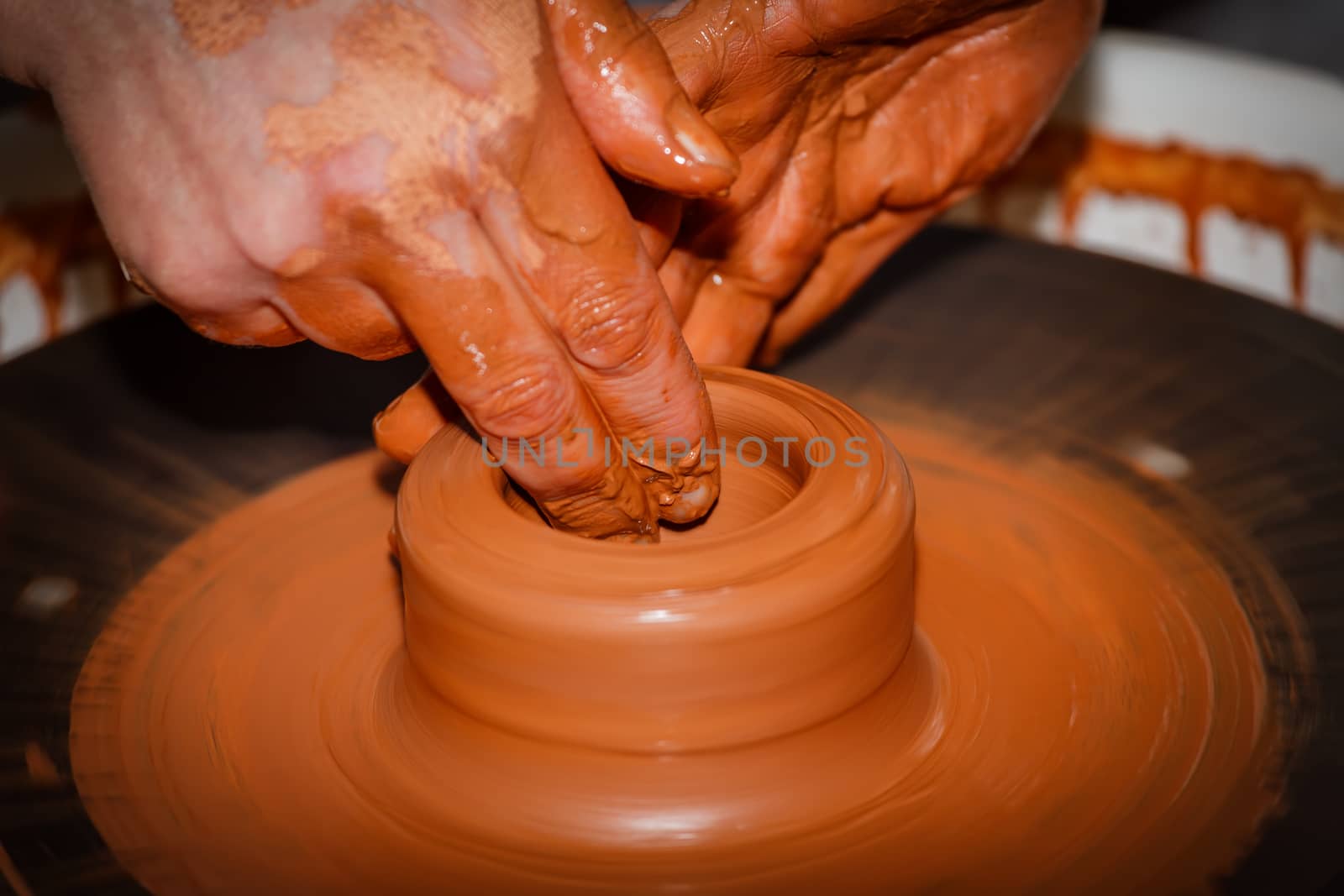 The process of creating pottery by hand