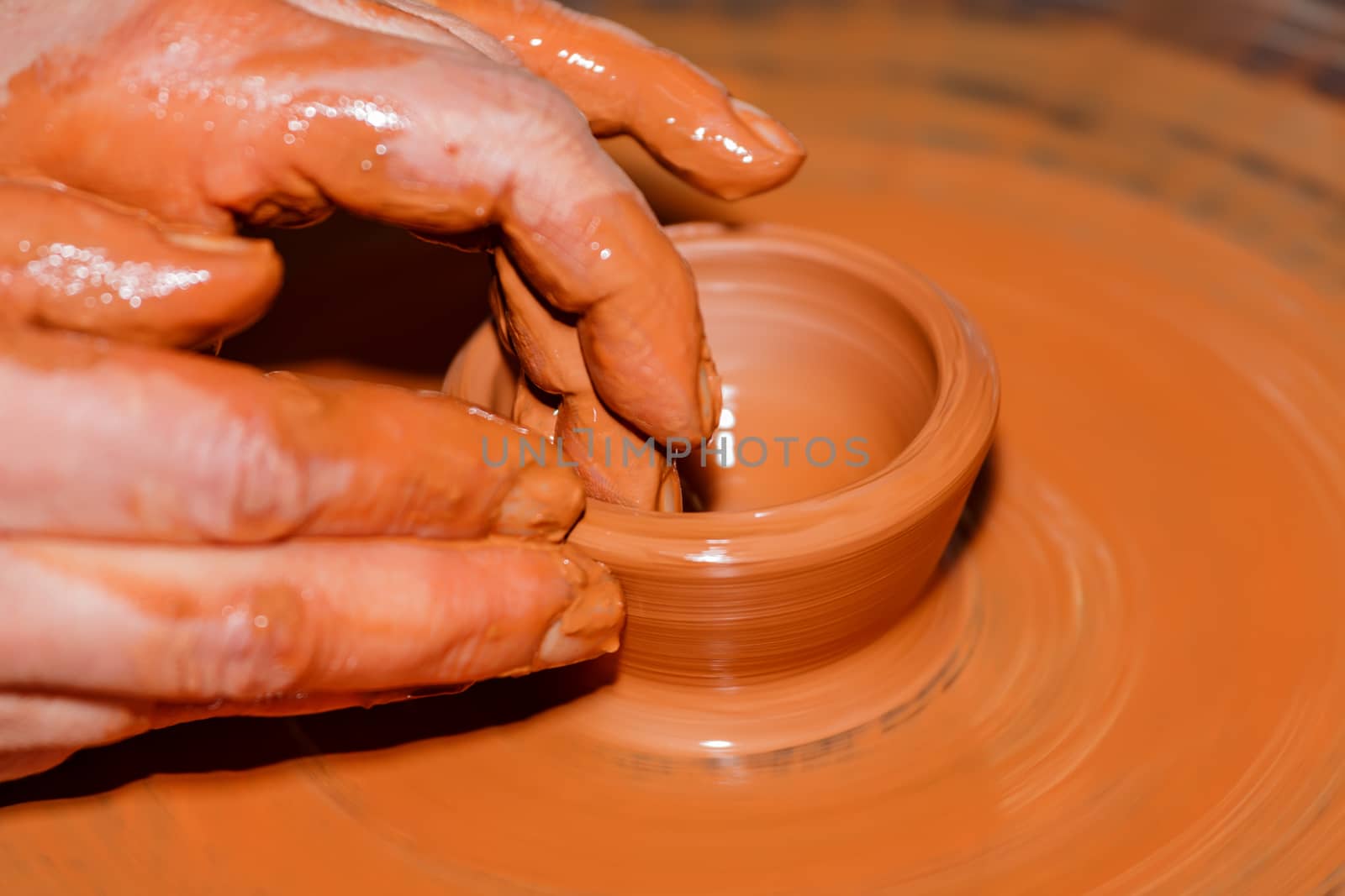 The process of creating pottery by hand