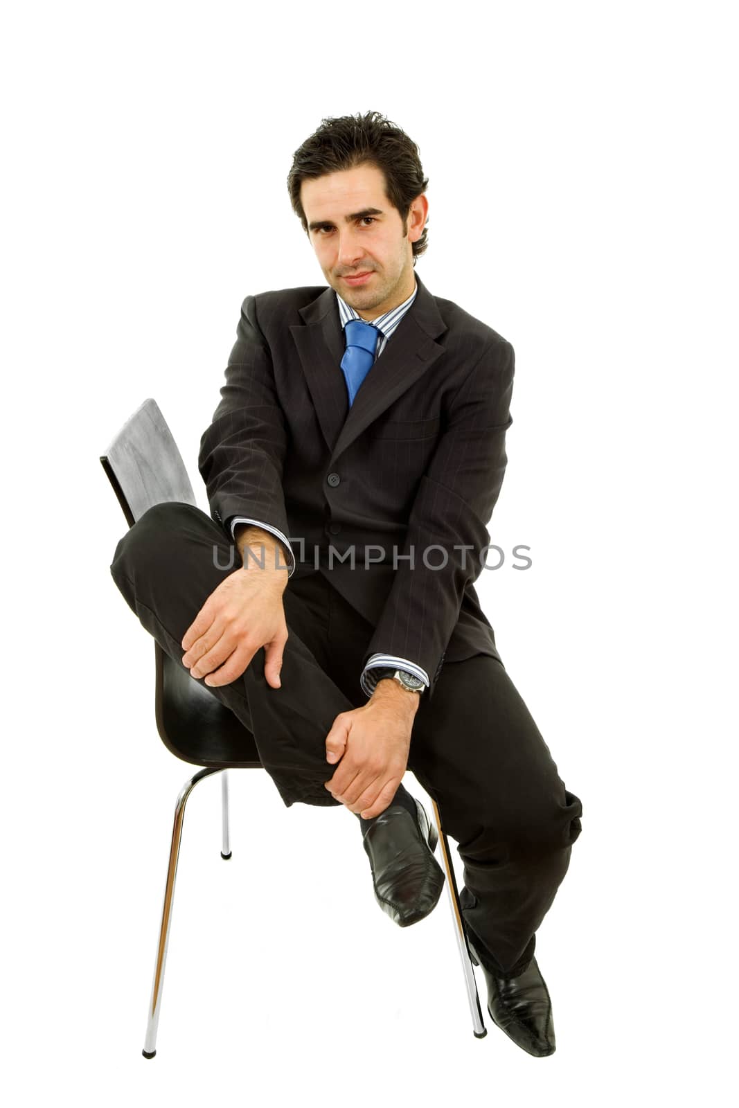 young businessman on a chair, isolated on white