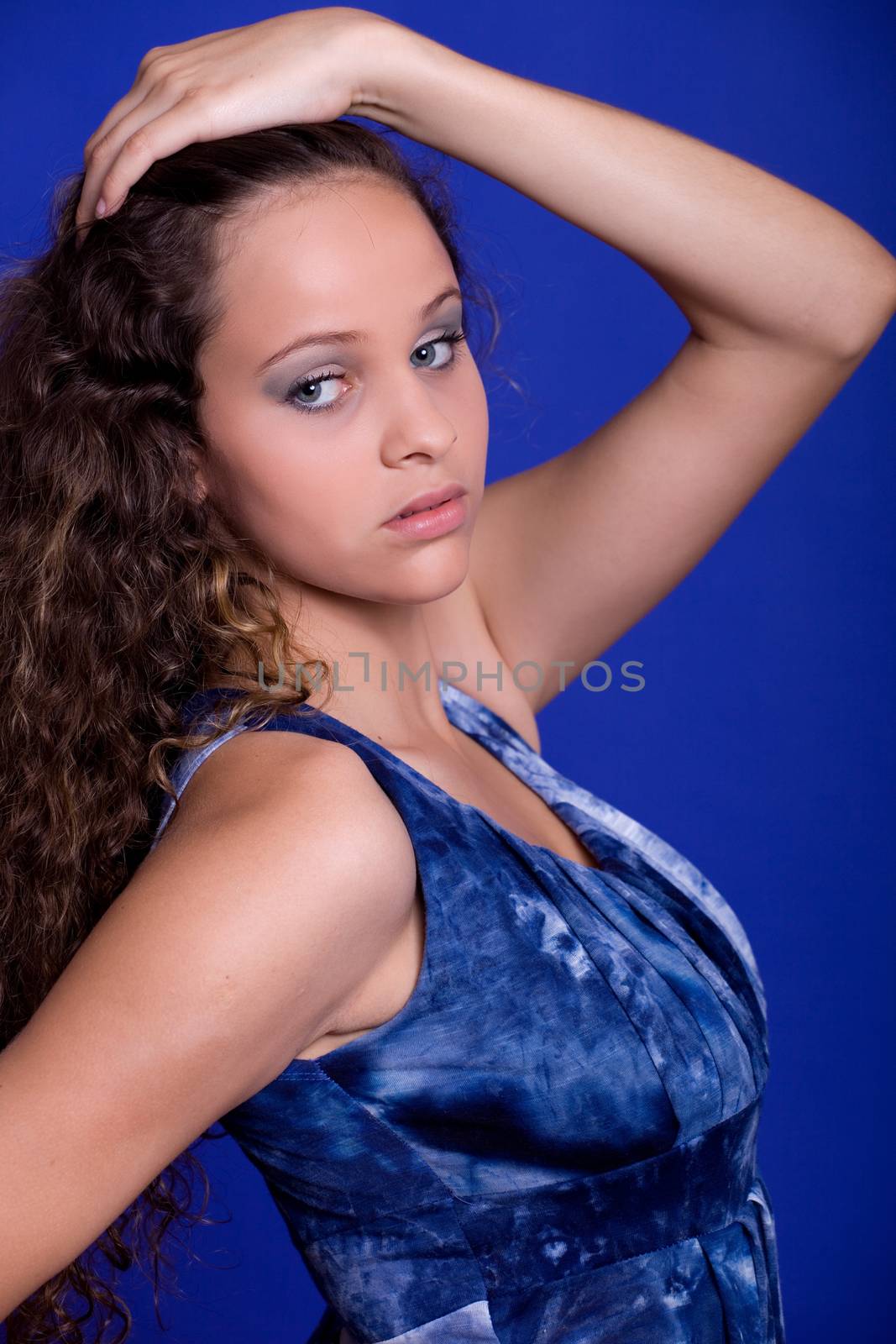 young beautiful woman, on a blue background