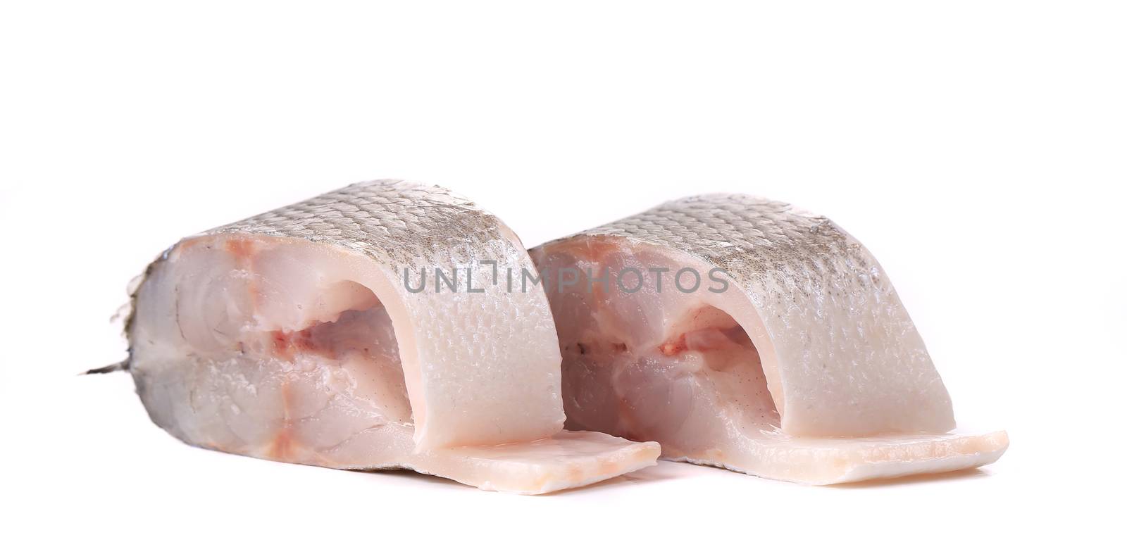 Two fresh steaks of seabass. Isolated on a white background.