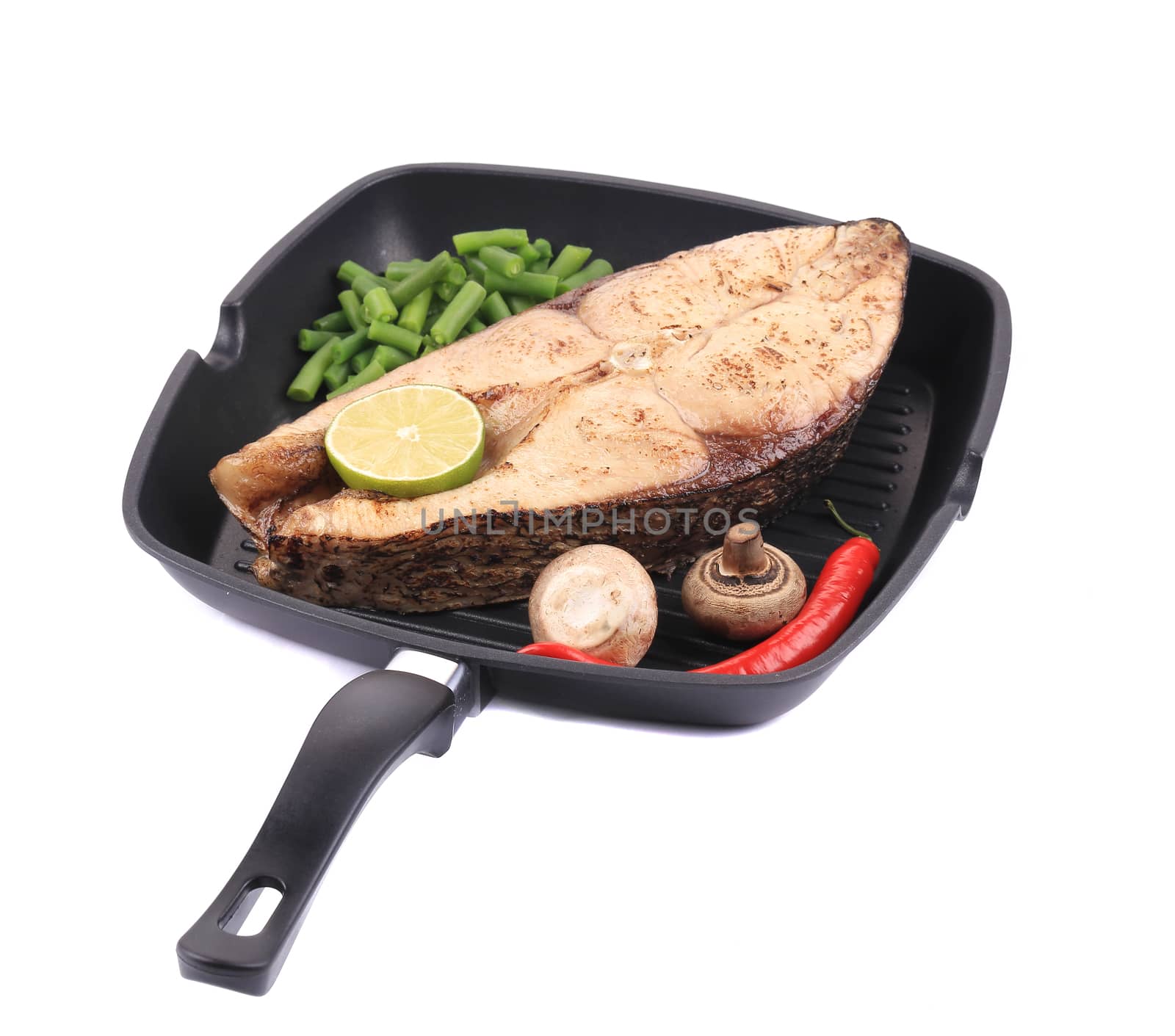 Grilled carp steak on pan. Isolated on a white background.