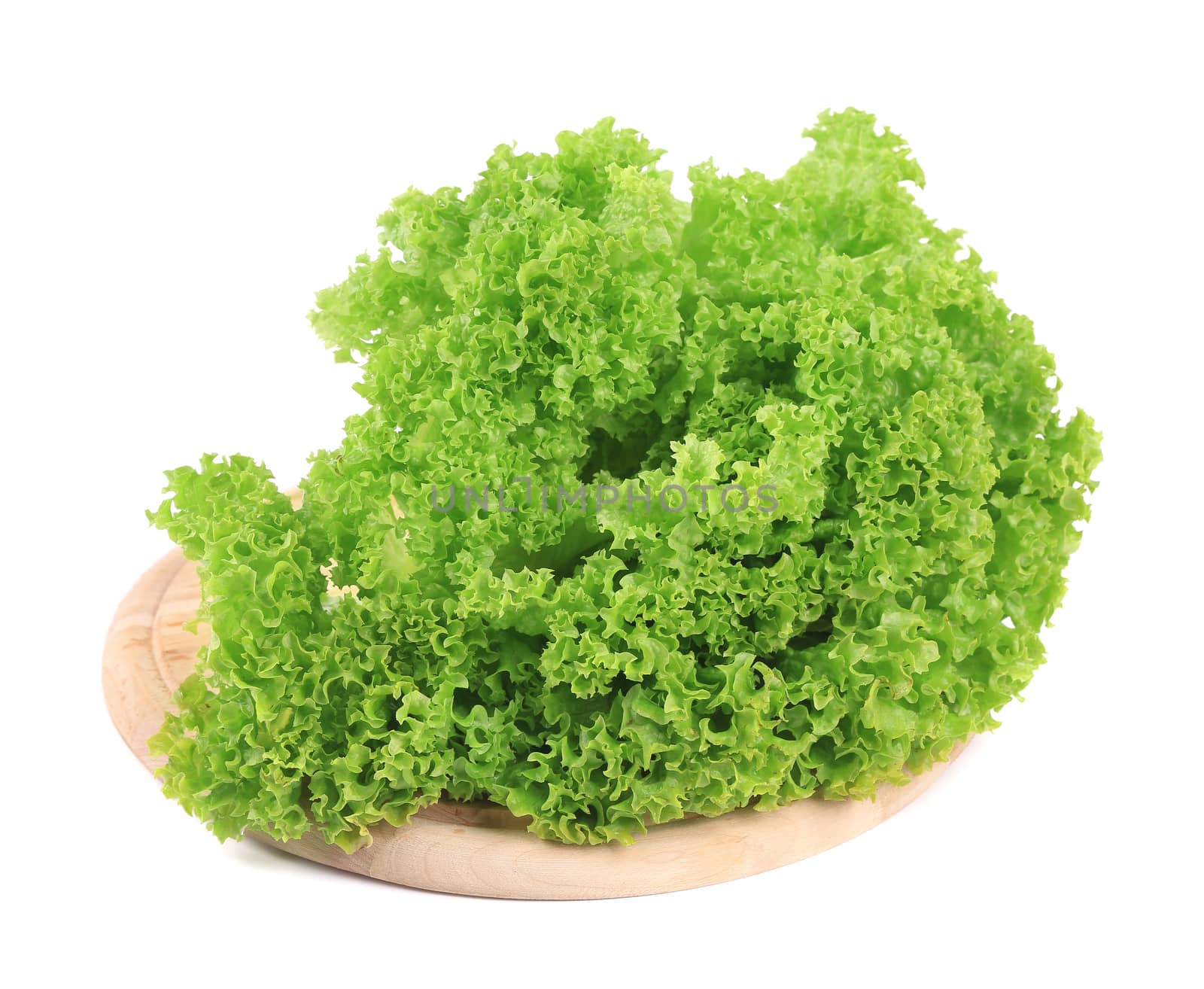 Fresh lettuce on wooden platter. Isolated on a white background.