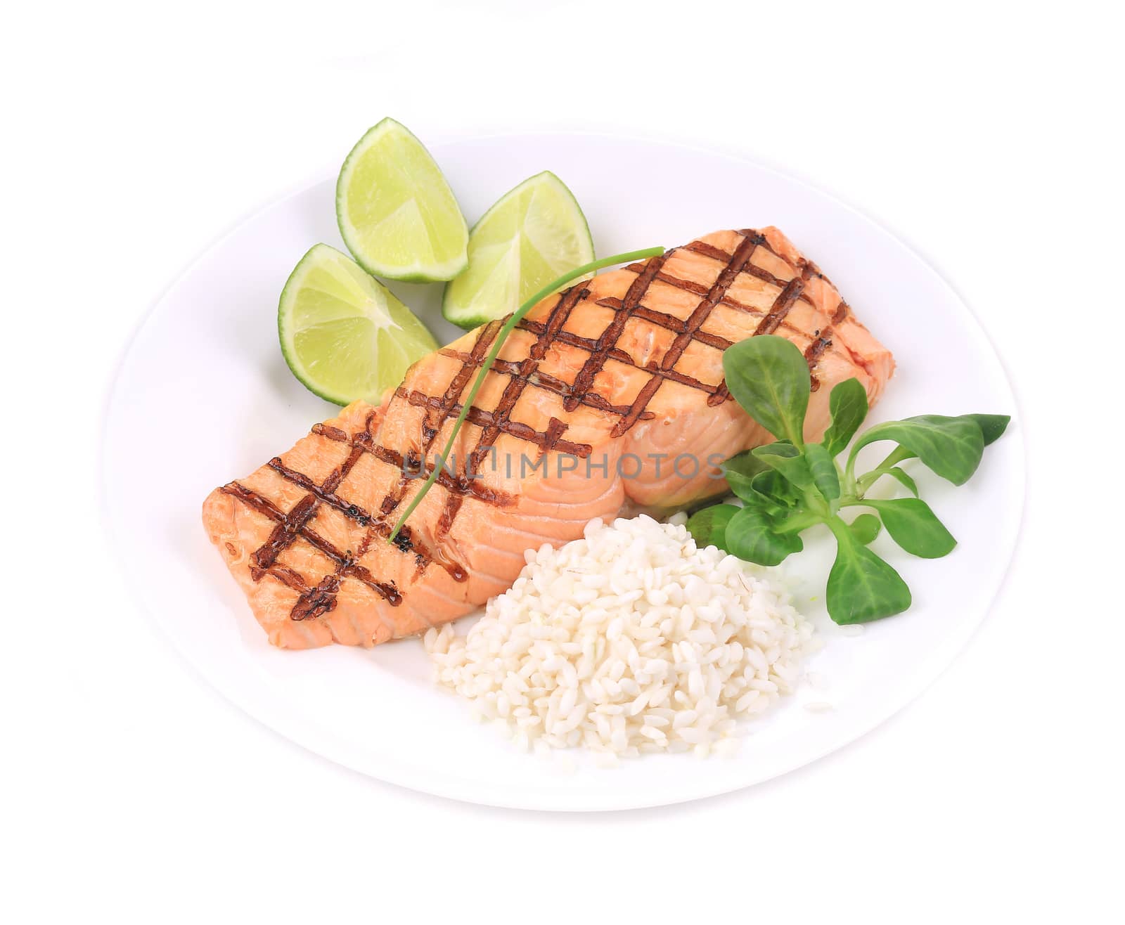 Roasted salmon fillets with rice. Isolated on a white background.
