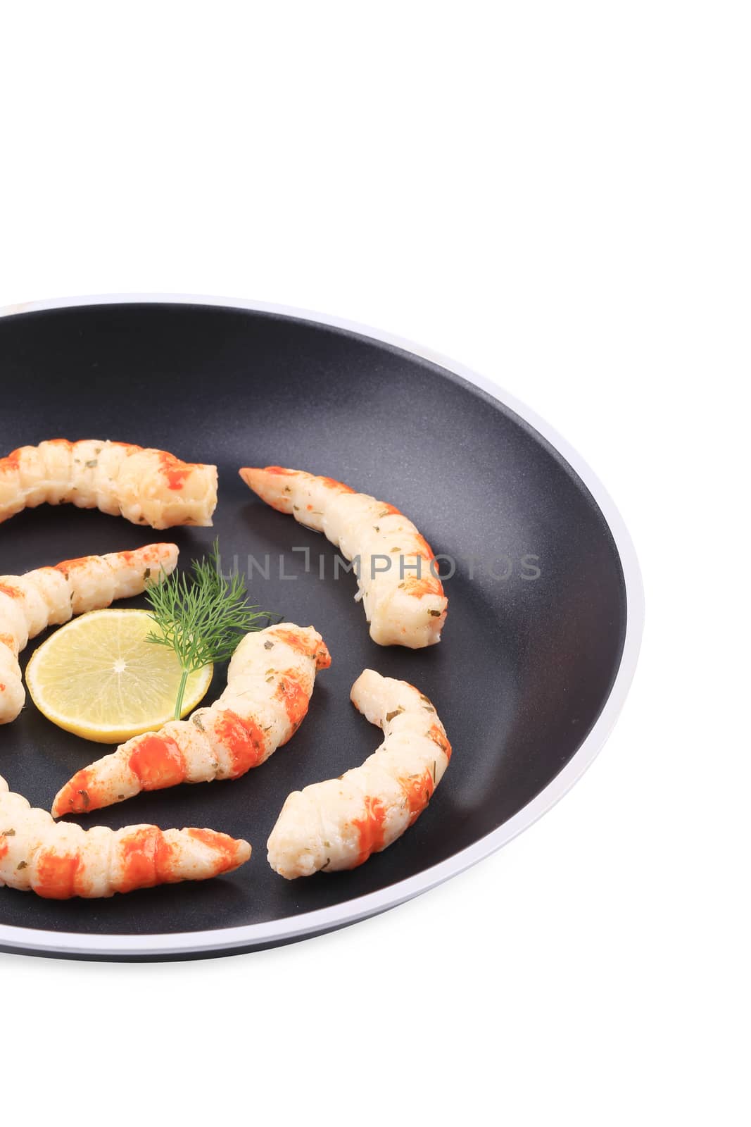 Cooked unshelled shrimps on frying pan. Whole background.