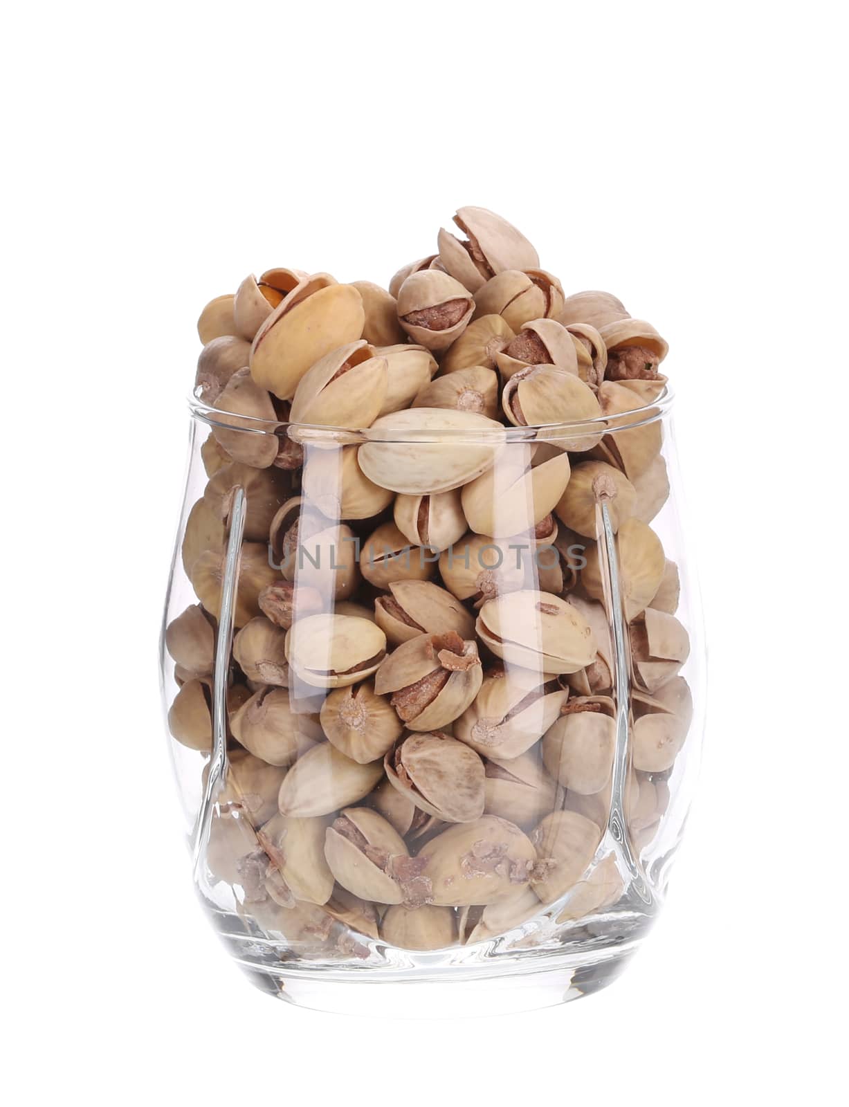 Full glass of pistachios. Isolated on a white background.