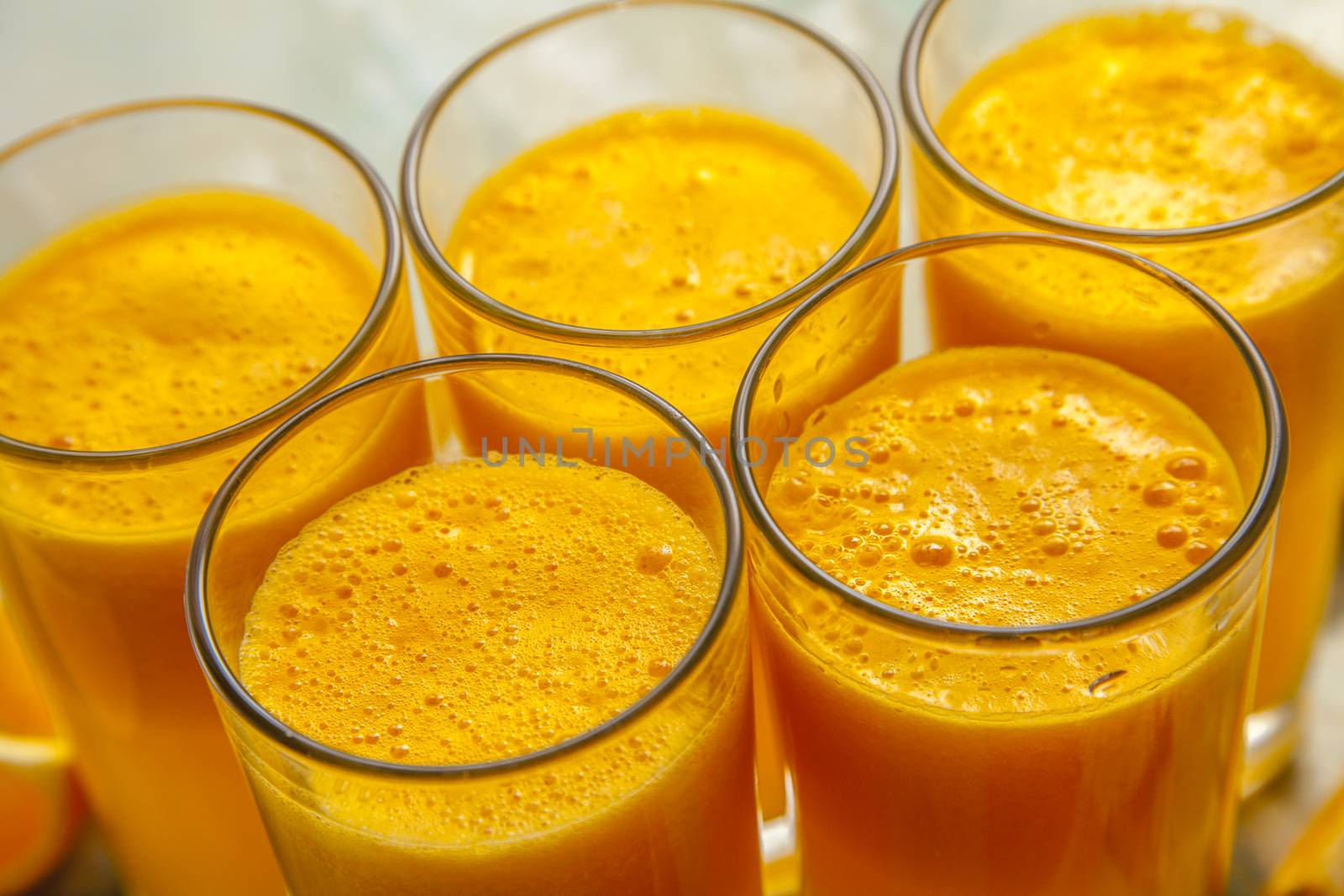 glasses of orange juice and fruits