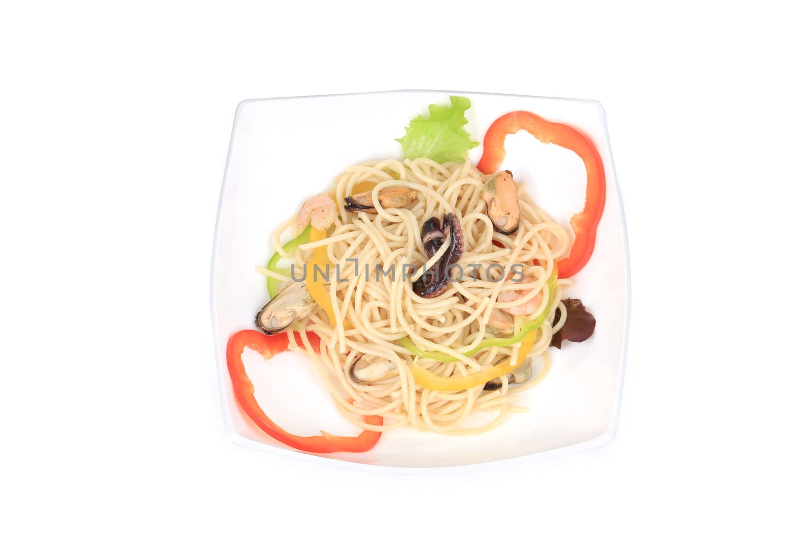 Seafood salad with spaghetti. Isolated on a white background.