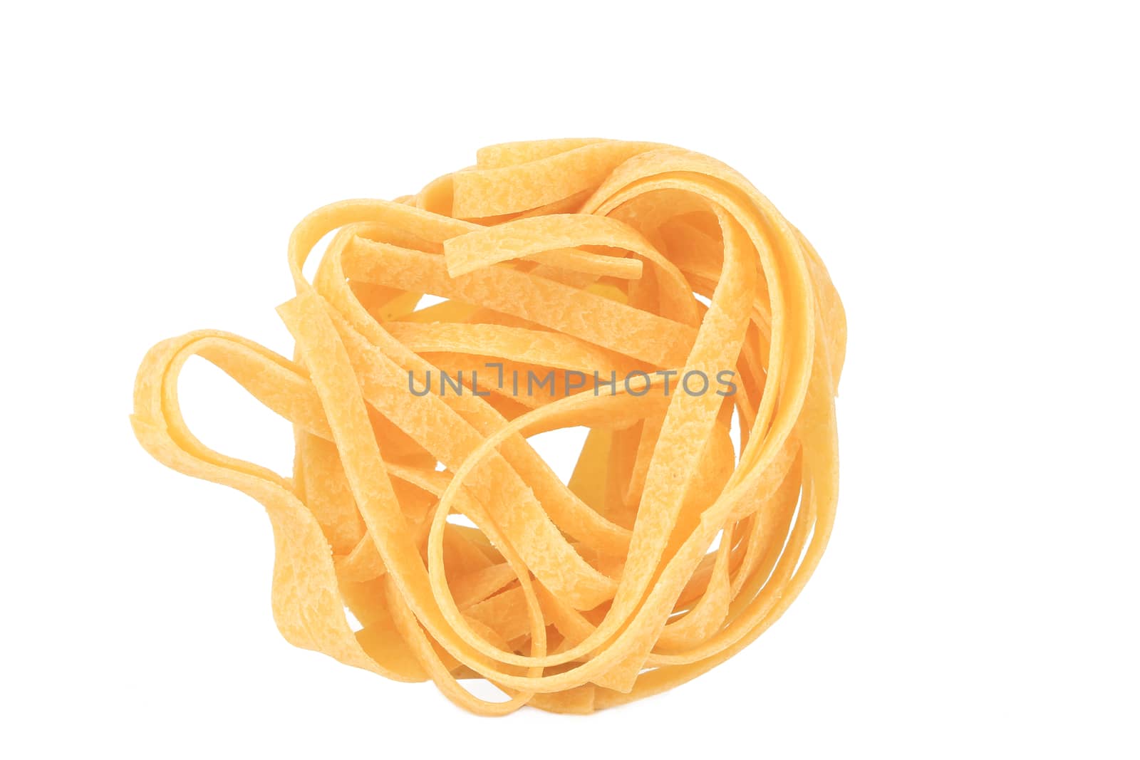 Tagliatelle paglia italian pasta. Isolated on a white background.