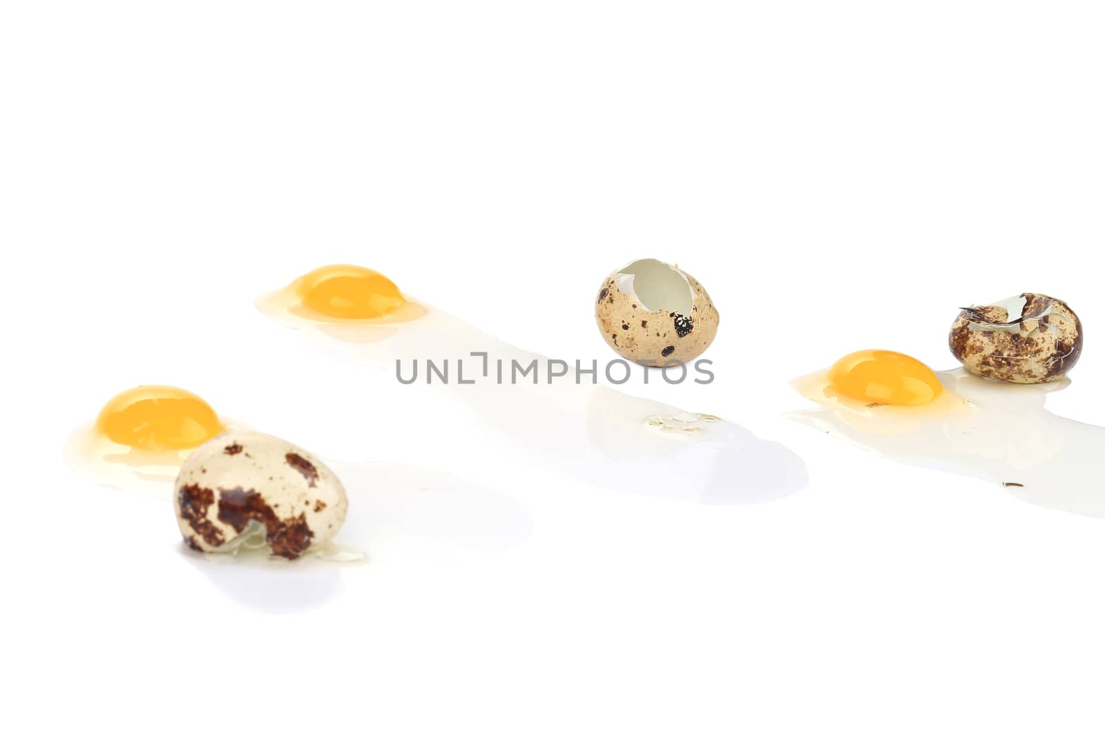 Broken quail eggs. Isolated on a white background.