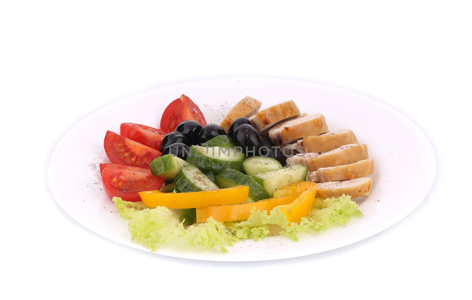Chicken salad and vegetables. Isolated on a white background.